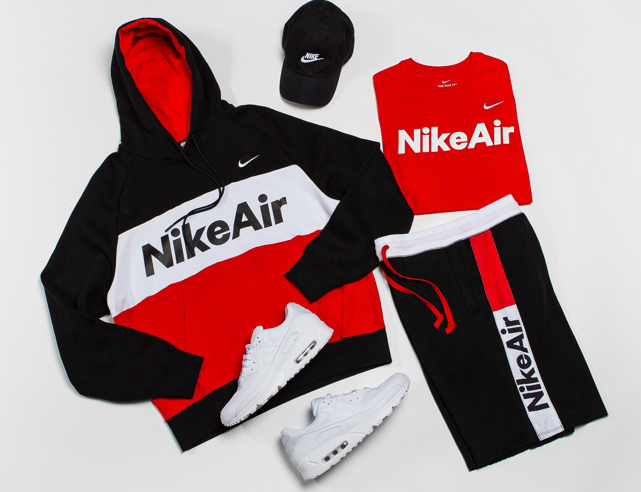 red and black nike jogging suit