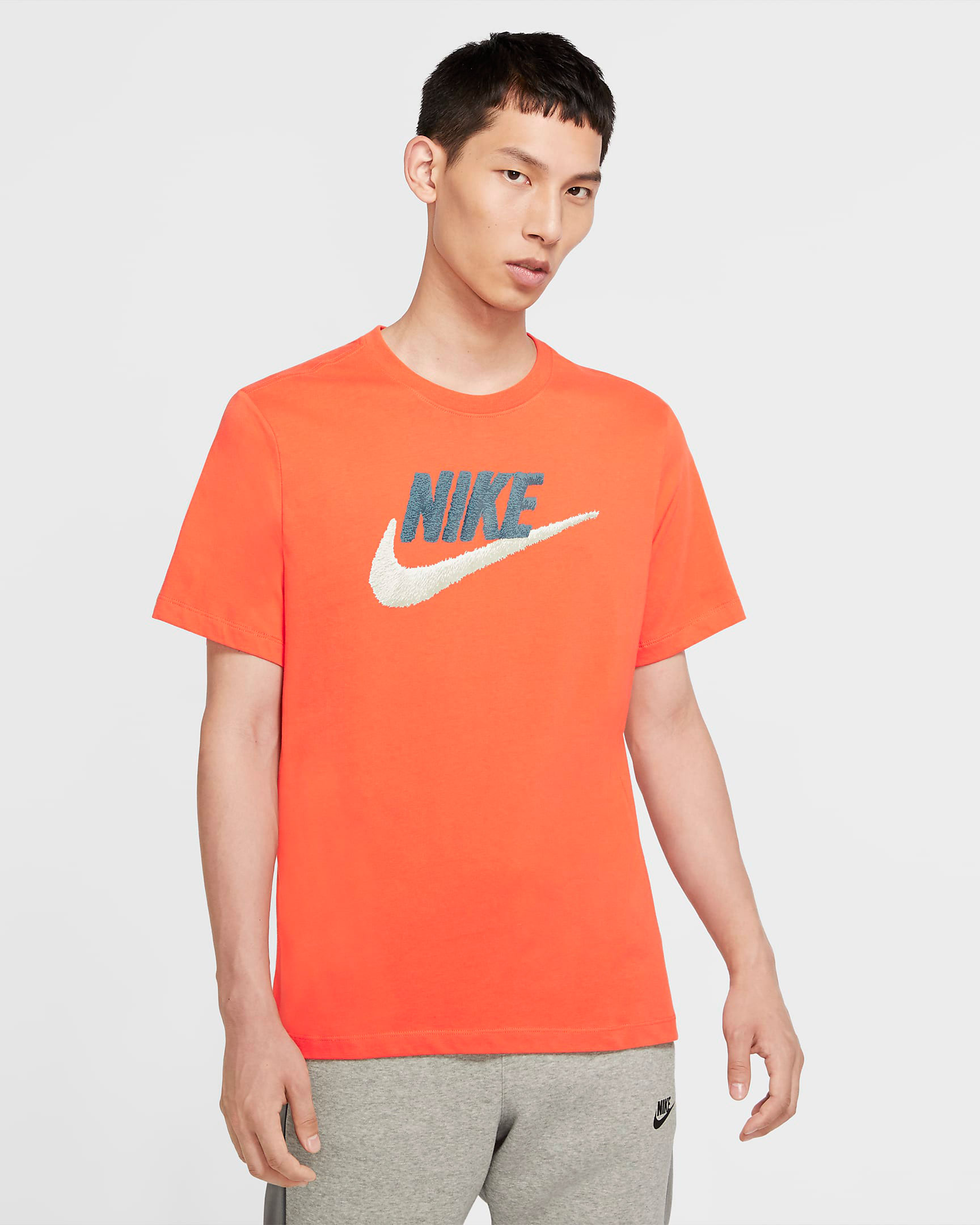 nike-logo-orange-shirt