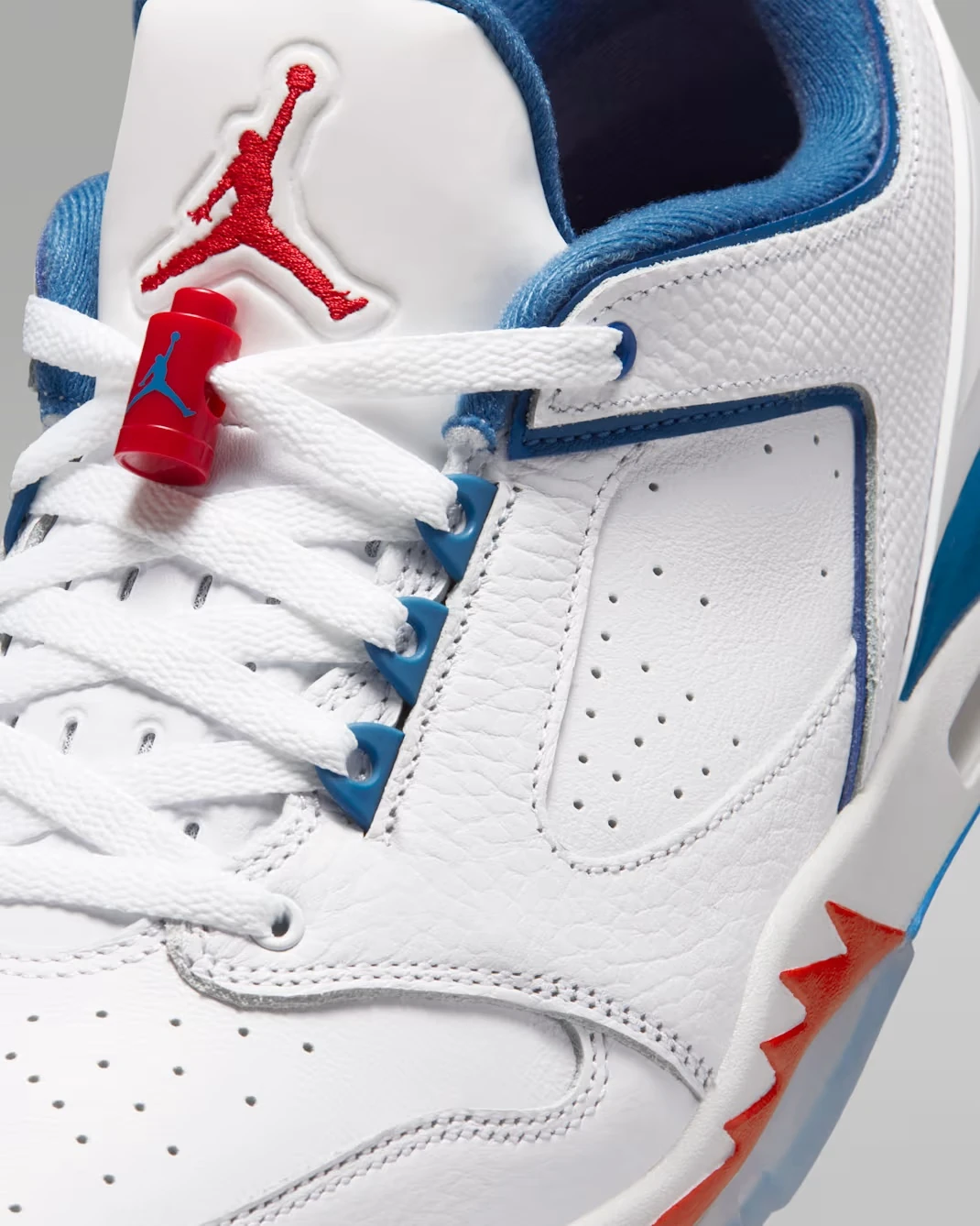 Close-up of the Jordan Sixty Plus Low "True Blue" showing the laces, lace lock and Jumpman logo.