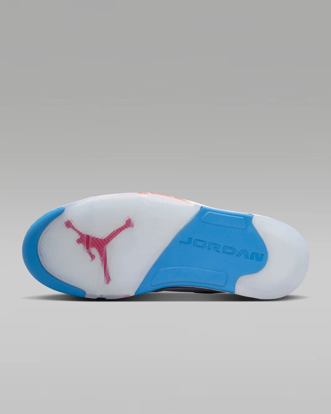 Outsole of the Jordan Sixty Plus Low "True Blue" featuring translucent rubber and a red Jumpman logo.