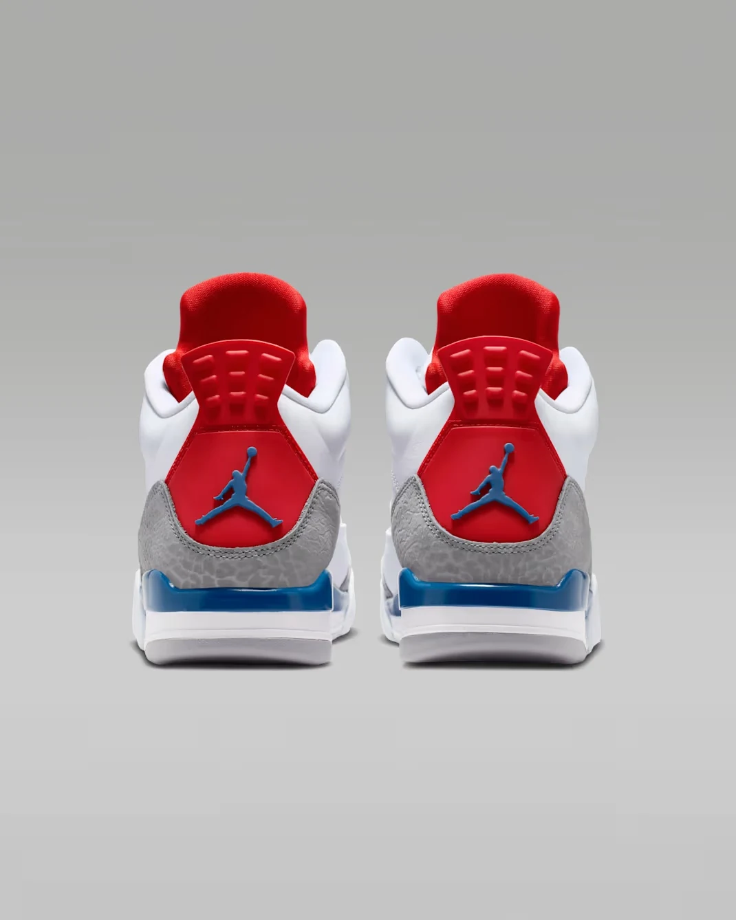 Rear view of the Jordan Son of Mars Low "True Blue" with Varsity Red heel tabs and True Blue Jumpman logos.