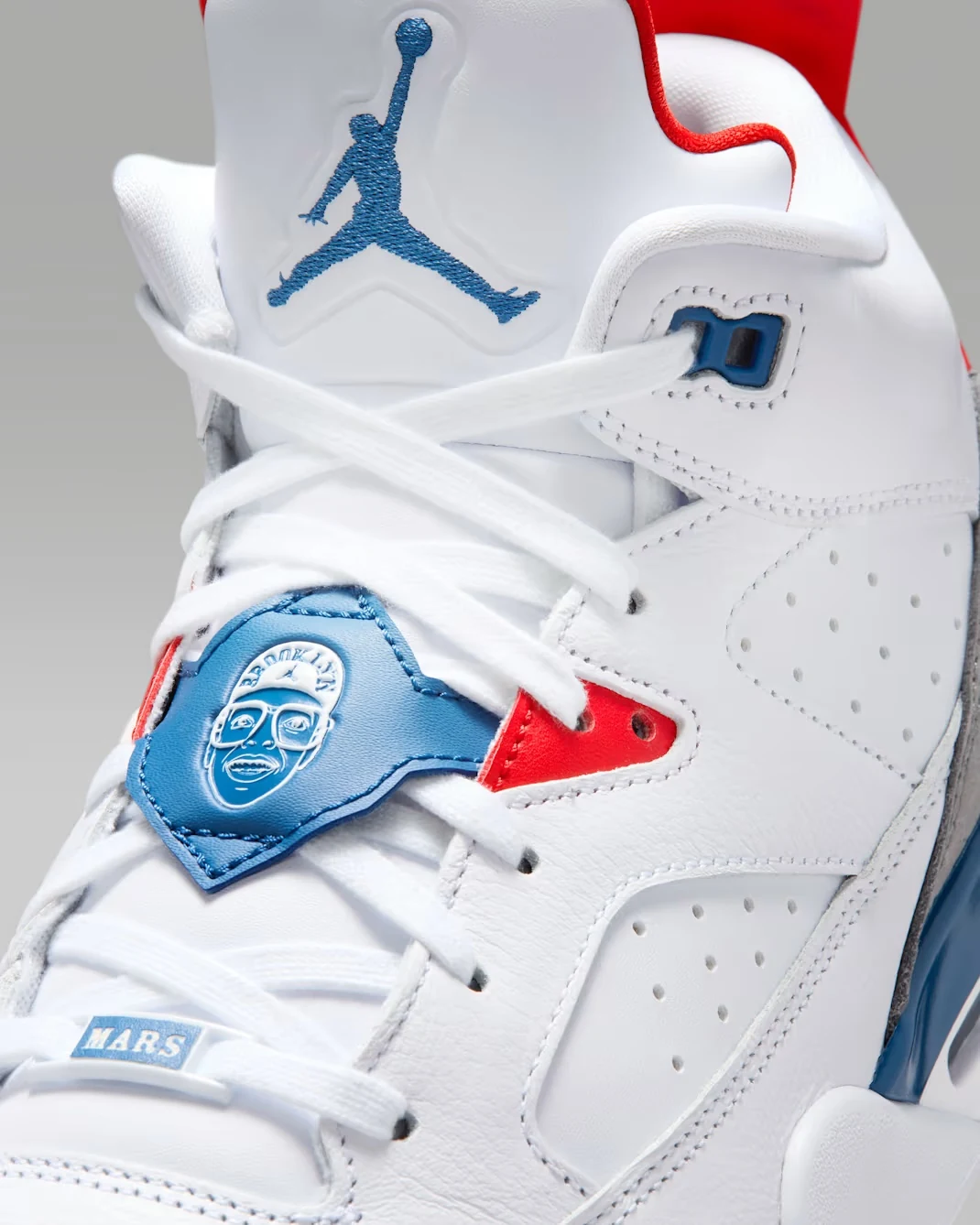 Close-up of the Spike Lee lace shroud on the Jordan Son of Mars Low "True Blue."