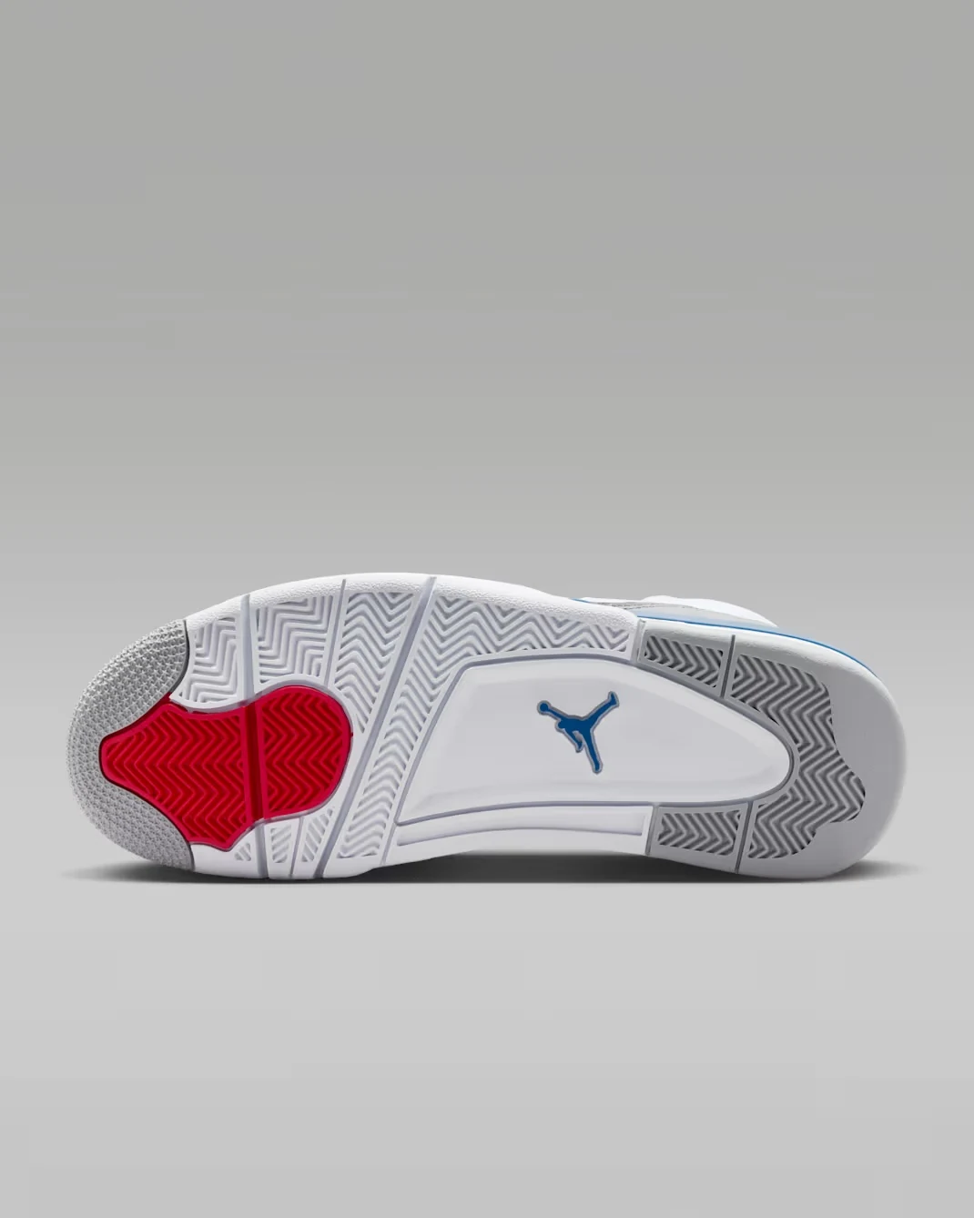 Rubber outsole of the Jordan Son of Mars Low "True Blue" featuring white, grey, True Blue and Varsity Red traction zones.