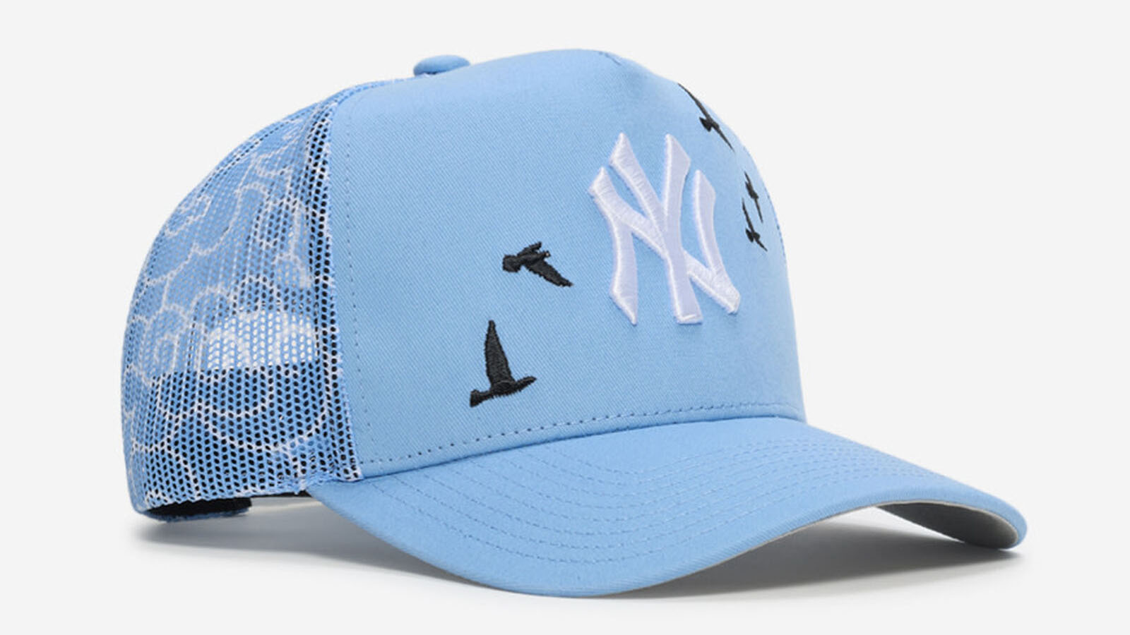 New York Yankees Mitchell & Ness Trucker Clouds Snapback Hat in Carolina Blue and white to match the Air Jordan 5 Black Carolina 2026 sneakers.
