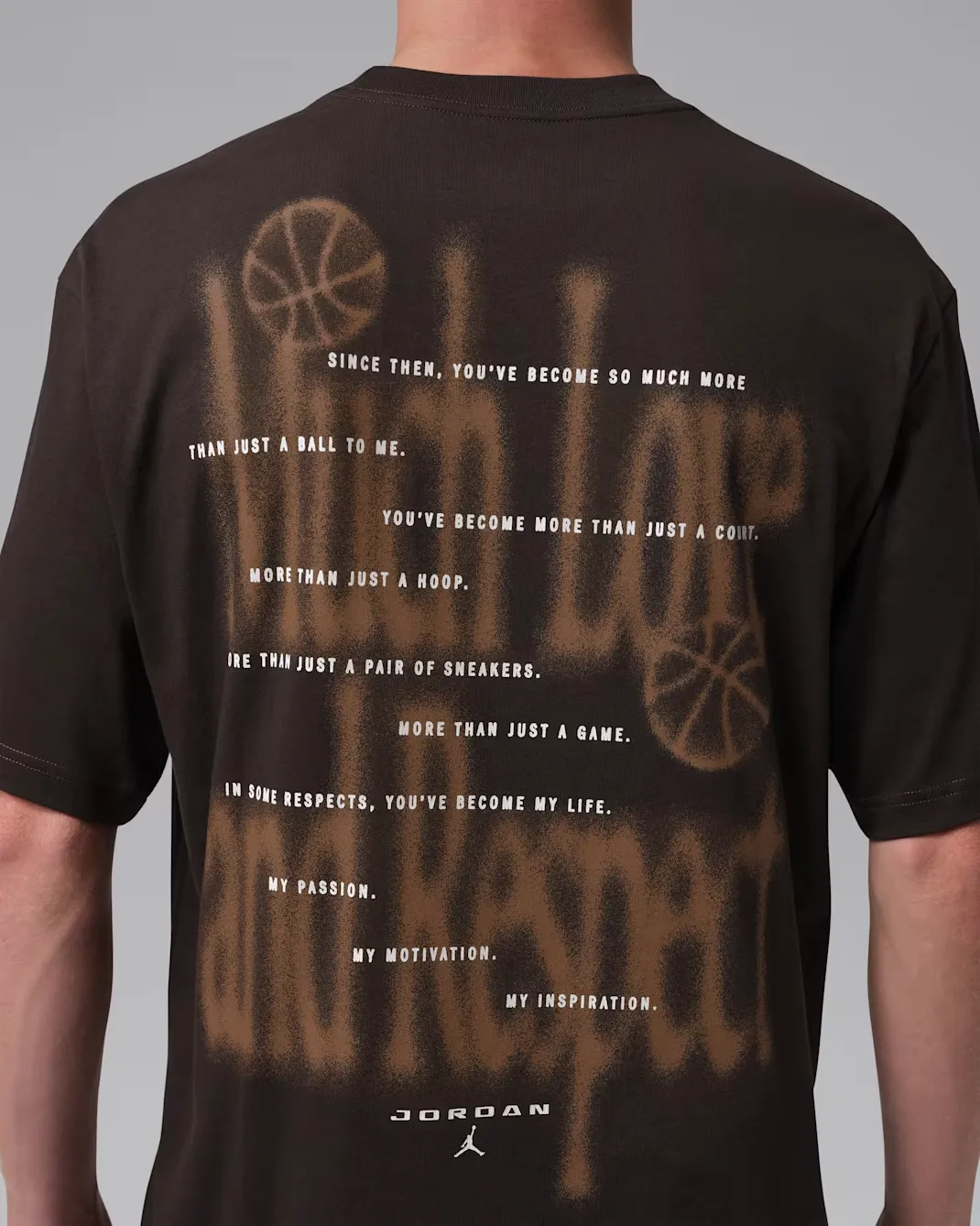 Close-up of the back graphic on the Jordan Brooklyn Love Letter T-Shirt in Shadow Brown featuring Love Letter artwork and inspirational text.