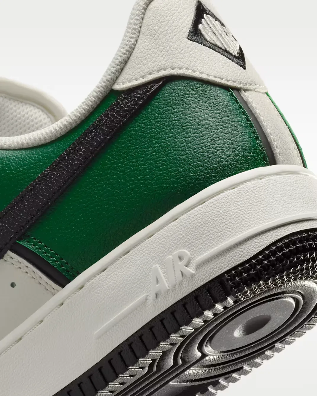Close-up of the heel on the Nike Air Force 1 '07 LV8 in Fir, Sail, Coconut Milk and Black.
