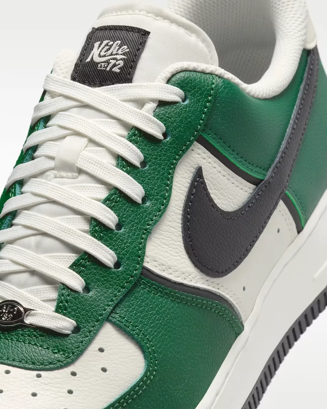 Close-up of the upper on the Nike Air Force 1 '07 LV8 in Fir, Sail, Coconut Milk and Black.