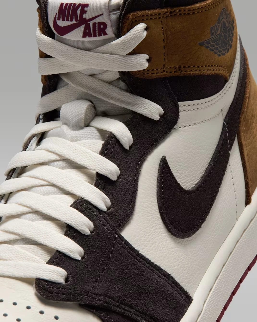 Close-up of the Nike Swoosh and premium suede overlays on the Air Jordan 1 High OG "Love Letter."