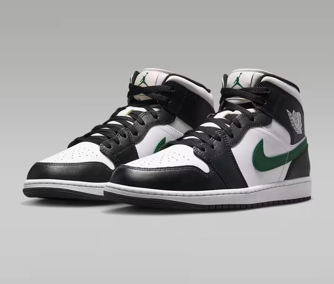 Angled view of the Air Jordan 1 Mid "Black/Gorge Green" sneakers.