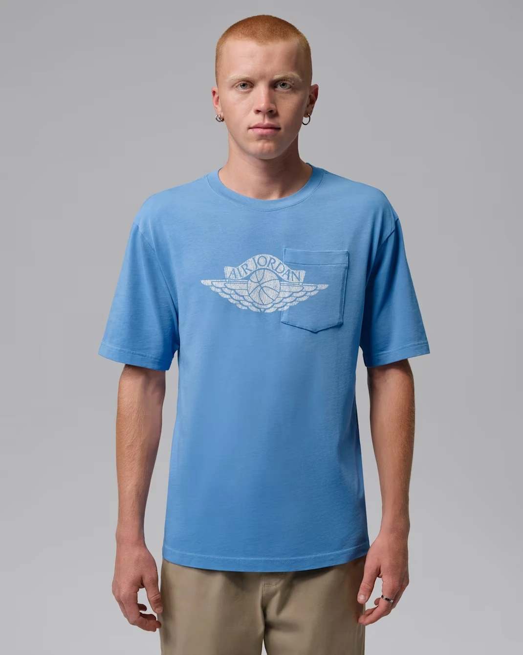 Jordan Flight Essentials Pocket T-Shirt in University Blue matching the Air Jordan 13 Flint (2026).
