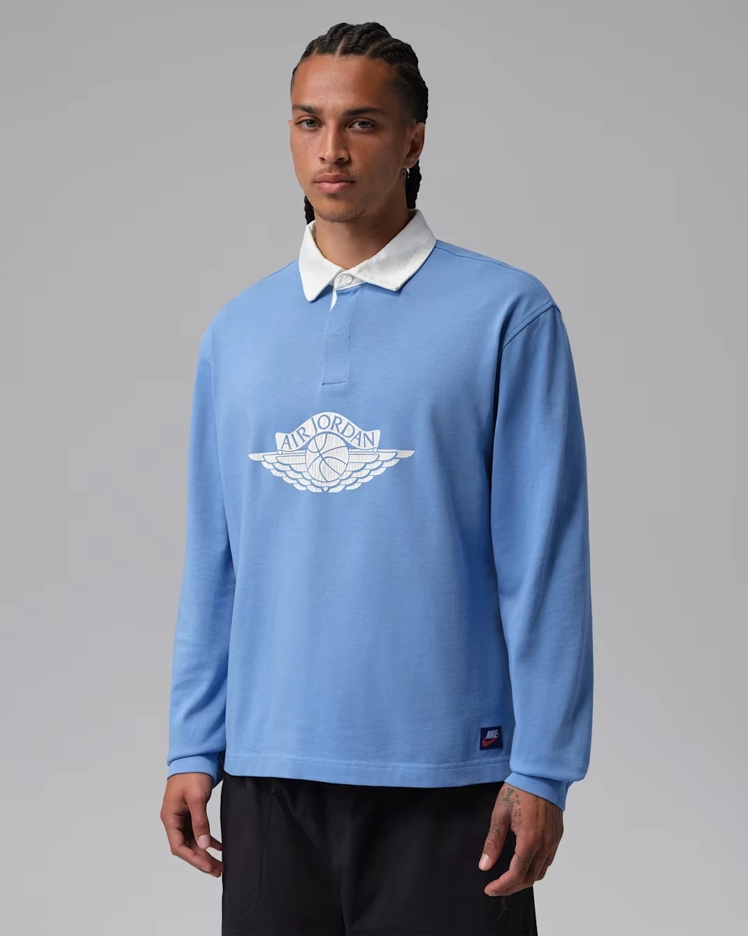 Jordan Flight Essentials Rugby Top in University Blue and White matching the Air Jordan 13 Flint (2026).
