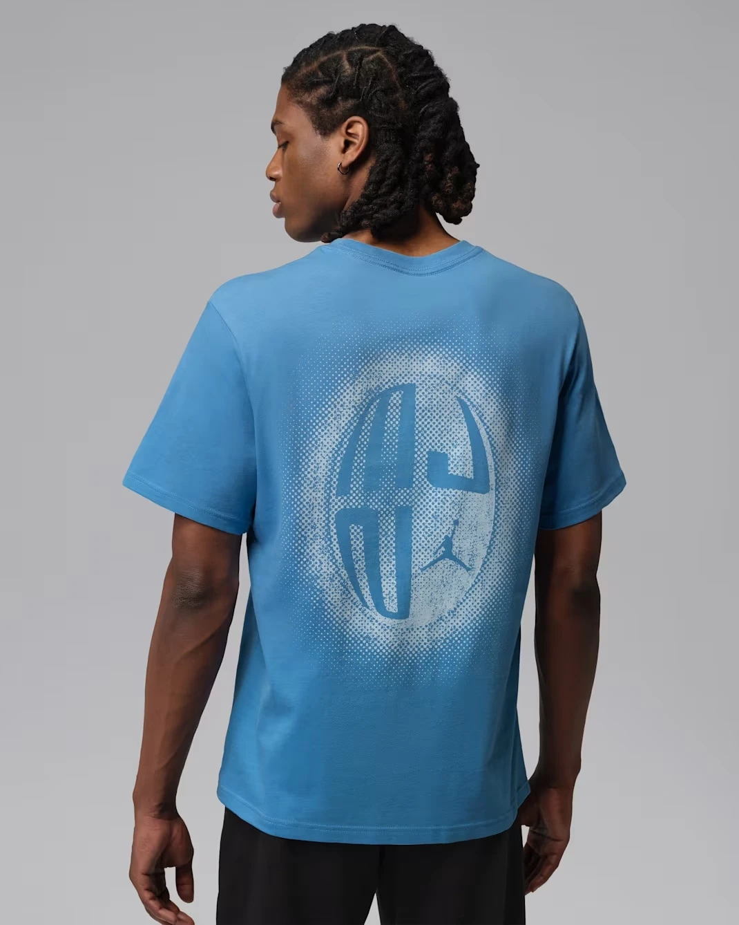Back view of the Jordan Sport Dri-FIT Graphic T-Shirt in University Blue matching the Air Jordan 13 Flint (2026).