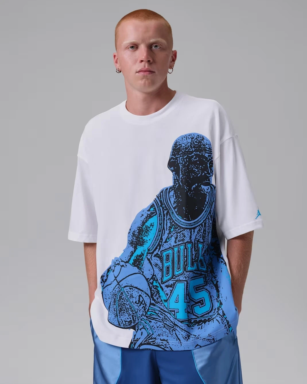 Jordan Sport Dri-FIT Graphic T-Shirt in White and University Blue matching the Air Jordan 13 Flint (2026).