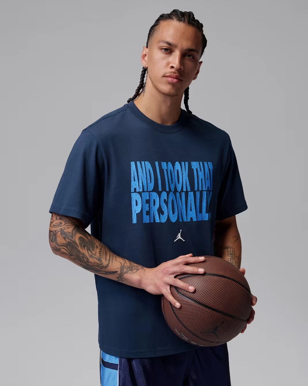 Lifestyle view of the Jordan Sport Dri-FIT T-Shirt in Midnight Navy matching the Air Jordan 13 Flint (2026).