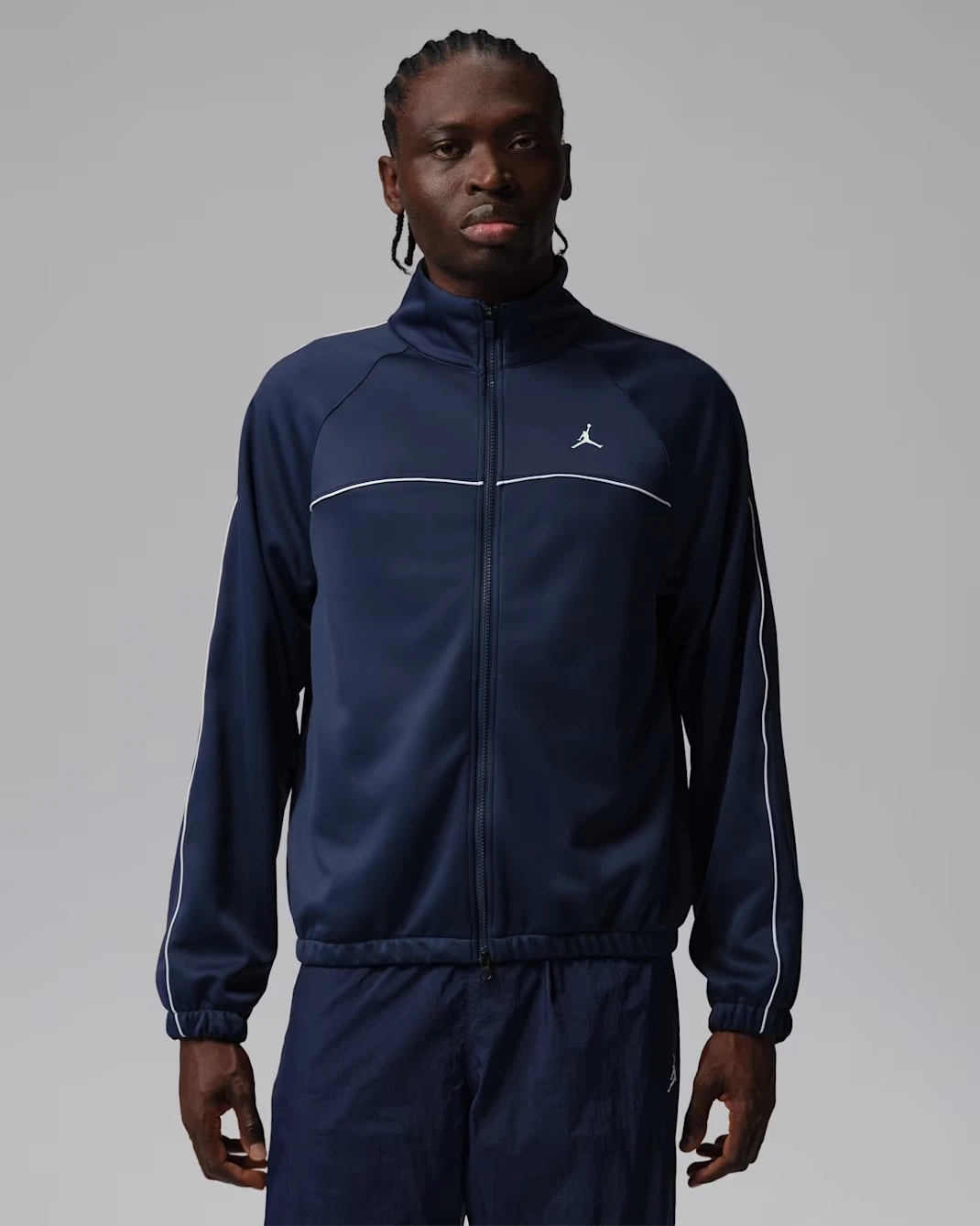 Jordan Track Jacket in Midnight Navy and White matching the Air Jordan 13 Flint (2026).