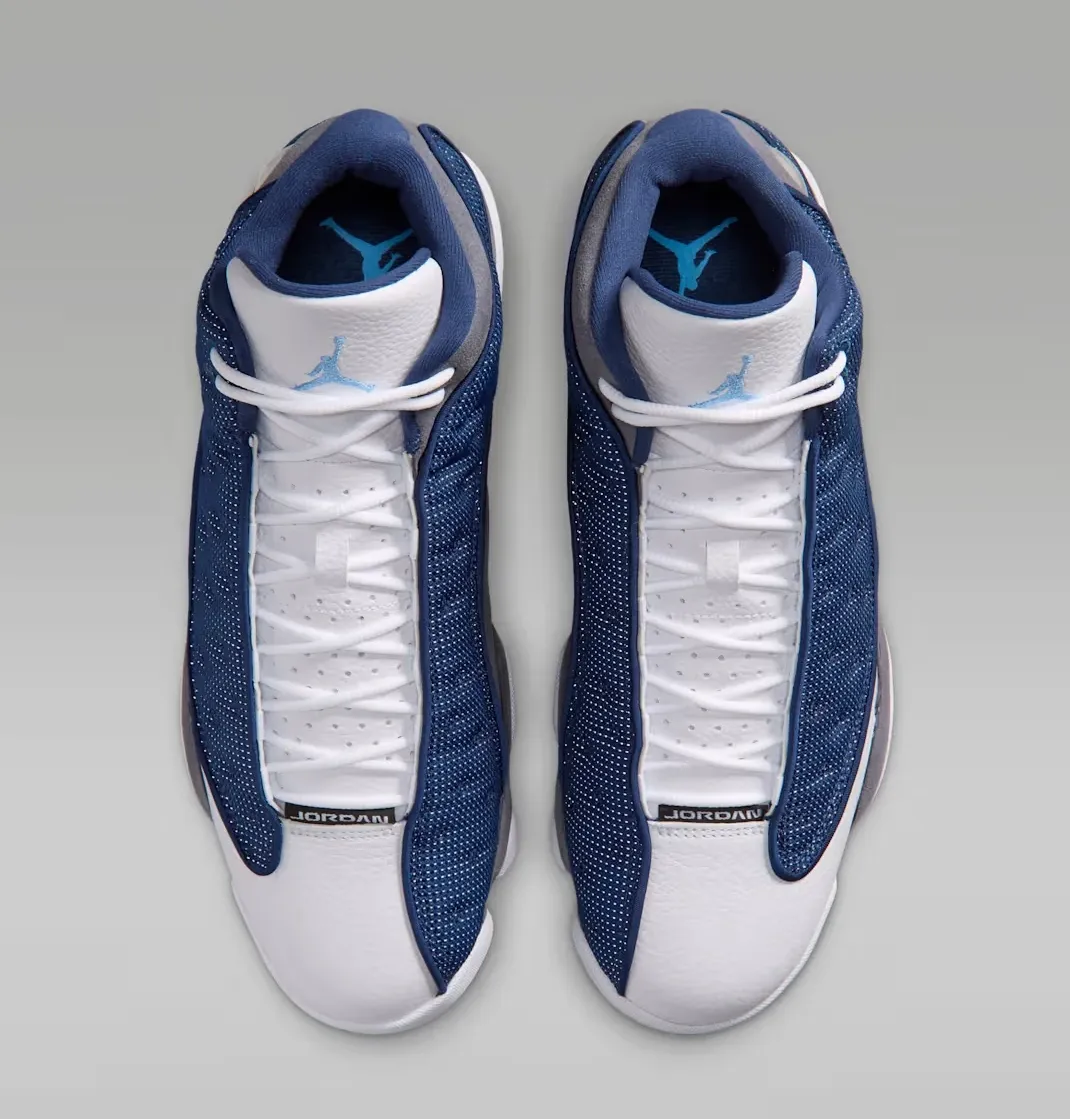 Top view of the Air Jordan 13 Flint (2026) in Navy, University Blue, Flint Grey, and White.