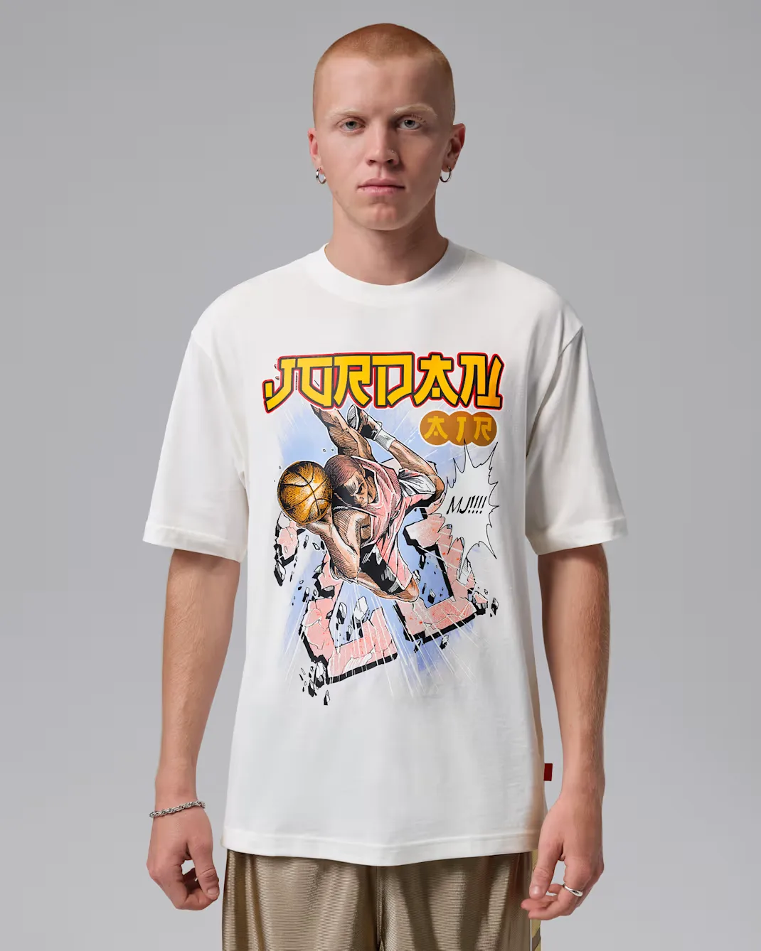 Model wearing the Jordan Brooklyn Anime T-Shirt in Sail featuring a colorful anime-inspired Michael Jordan graphic on the front.