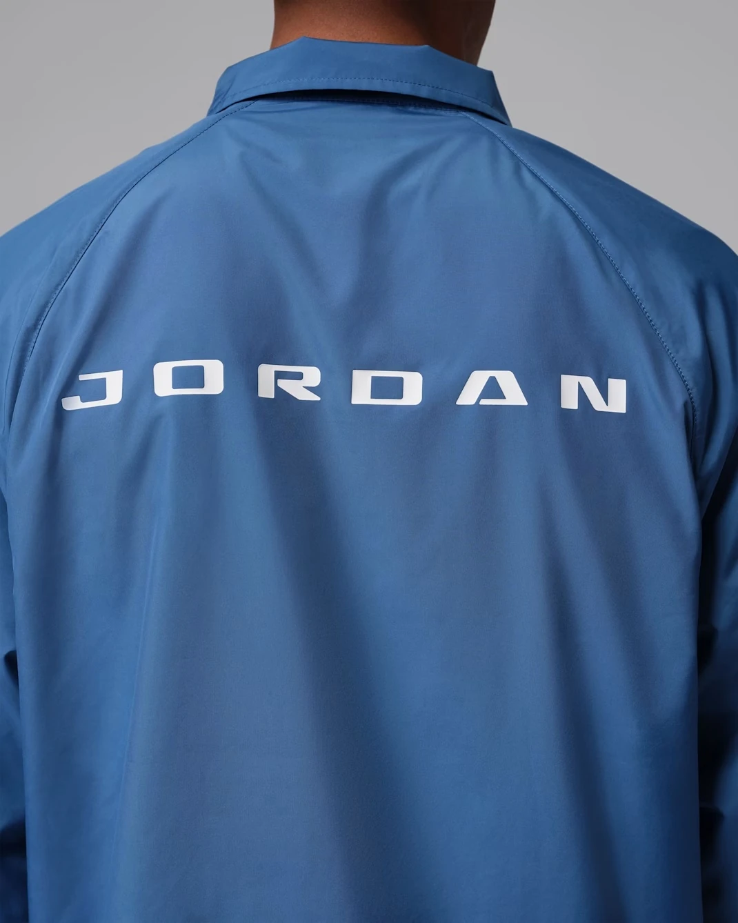 Large embroidered Jumpman logo on the back of the Jordan Brooklyn Coaches Jacket in True Blue.