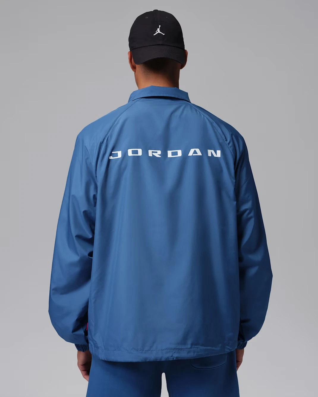 Back view of the Jordan Brooklyn Coaches Jacket in True Blue featuring oversized Jumpman branding to match the Air Jordan 3 "True Blue" (2026).