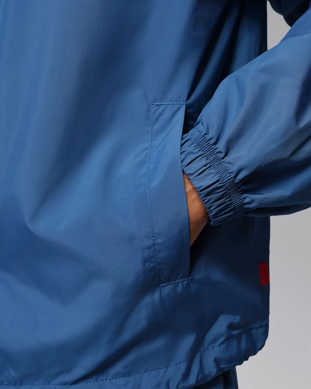 Side pocket detail on the Jordan Brooklyn Coaches Jacket in True Blue.