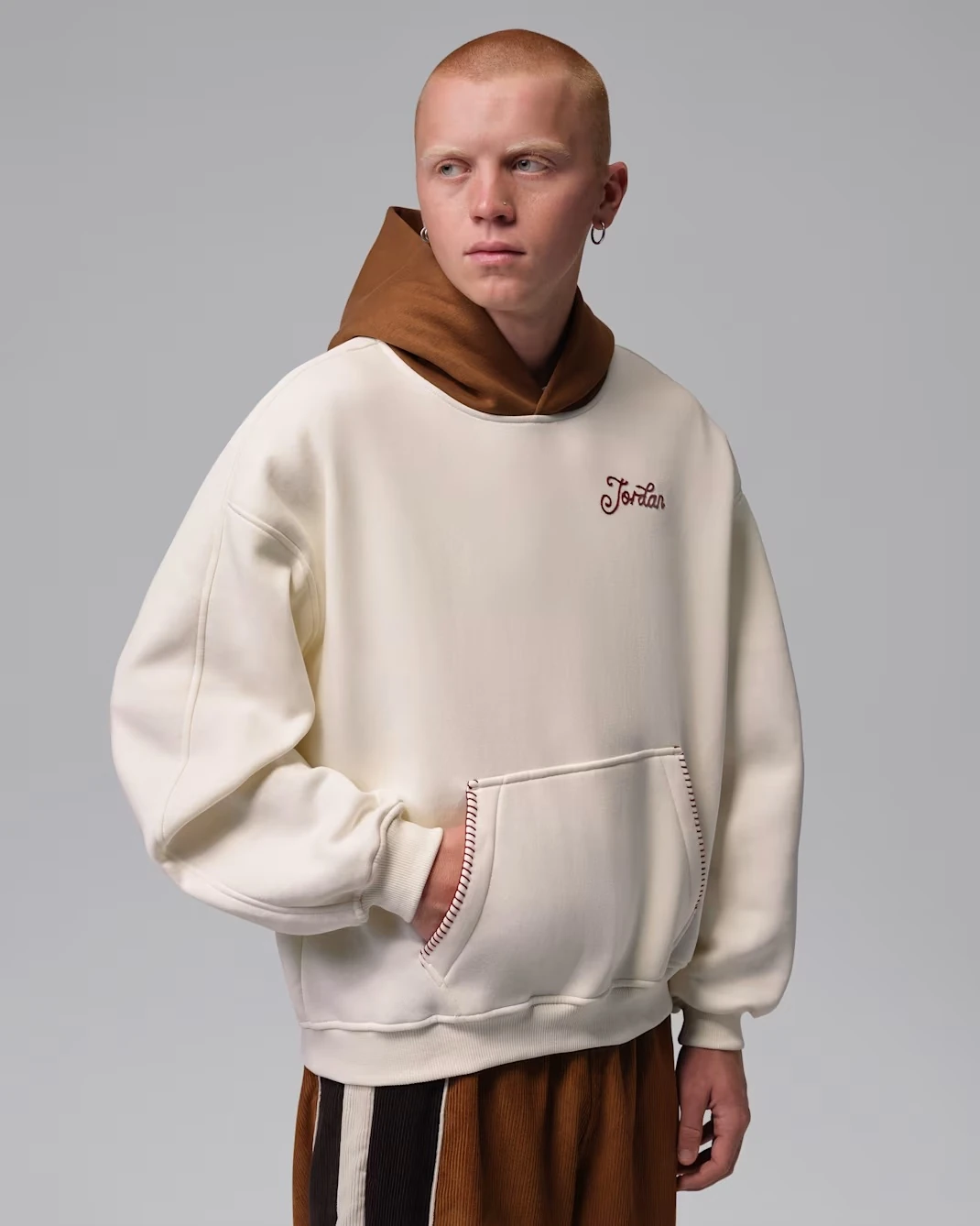 Front view of the Jordan Brooklyn Fleece Men's Oversized Pullover Hoodie in Soft Pearl and Light British Tan.