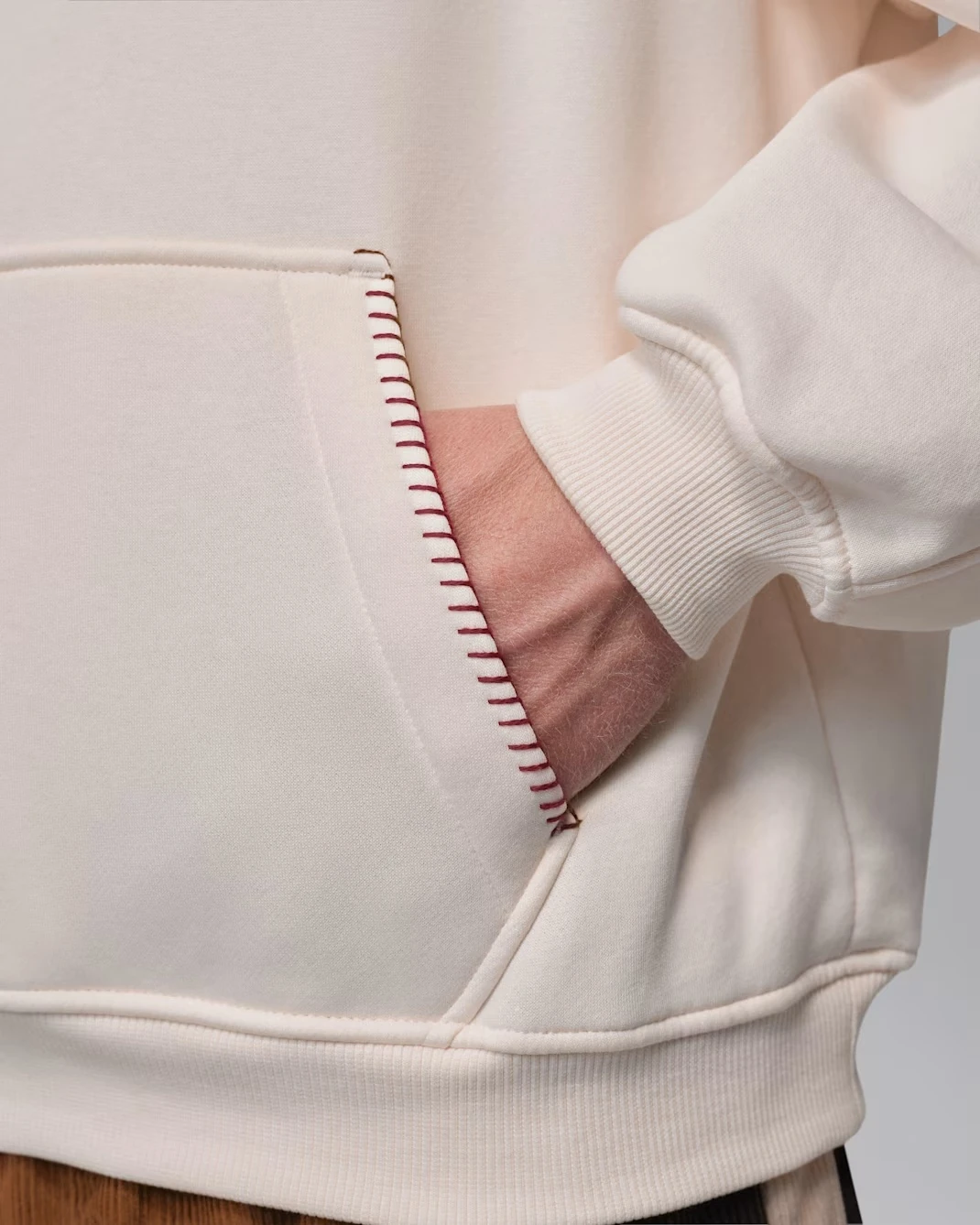 Close-up of the kangaroo pocket with contrast stitching on the Jordan Brooklyn Fleece Hoodie.