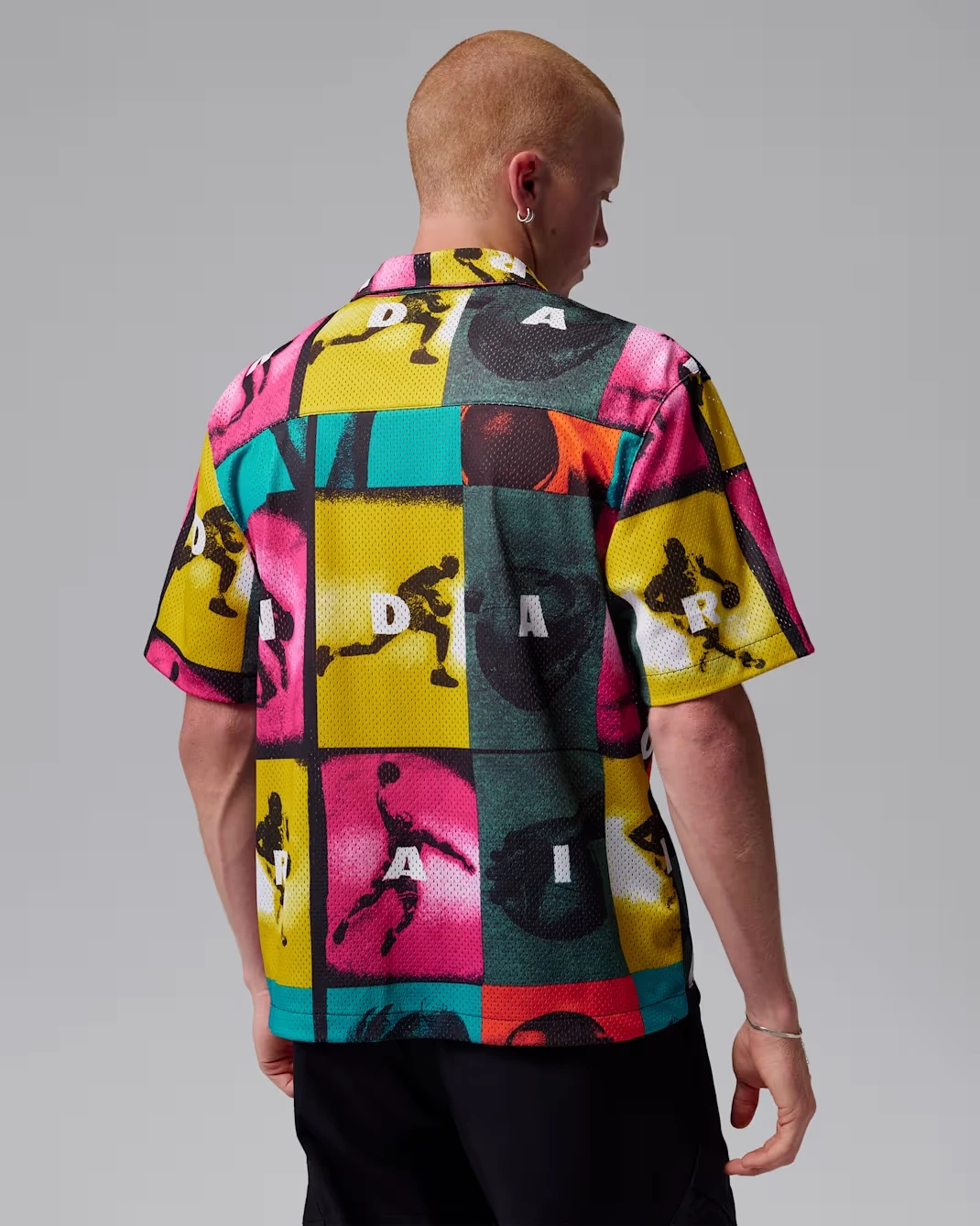 Back view of the Jordan Brooklyn Graphic Shirt in White with multicolor comic-inspired graphics.