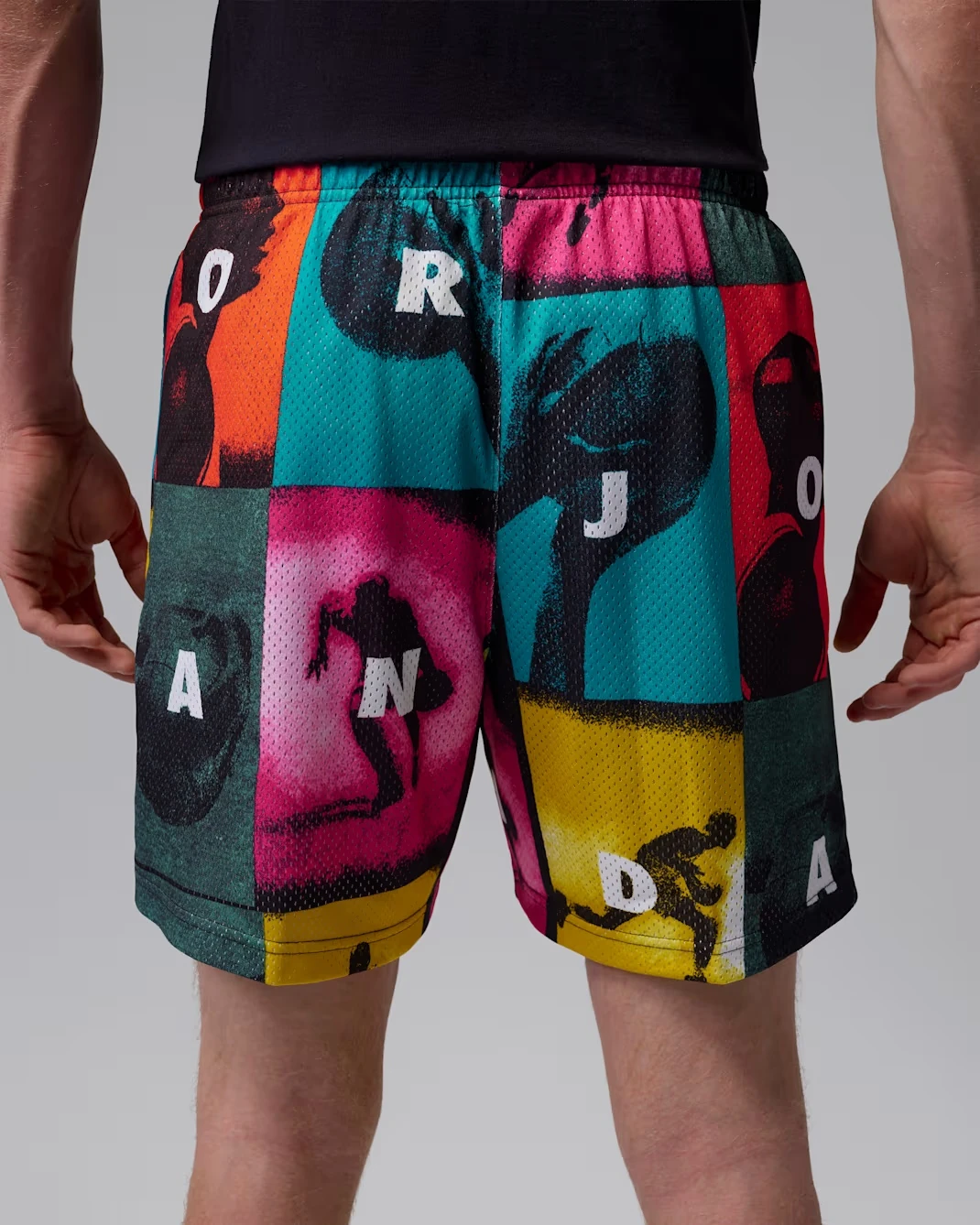 Back view of Jordan Brooklyn mesh shorts in White with multicolor comic-inspired graphics.