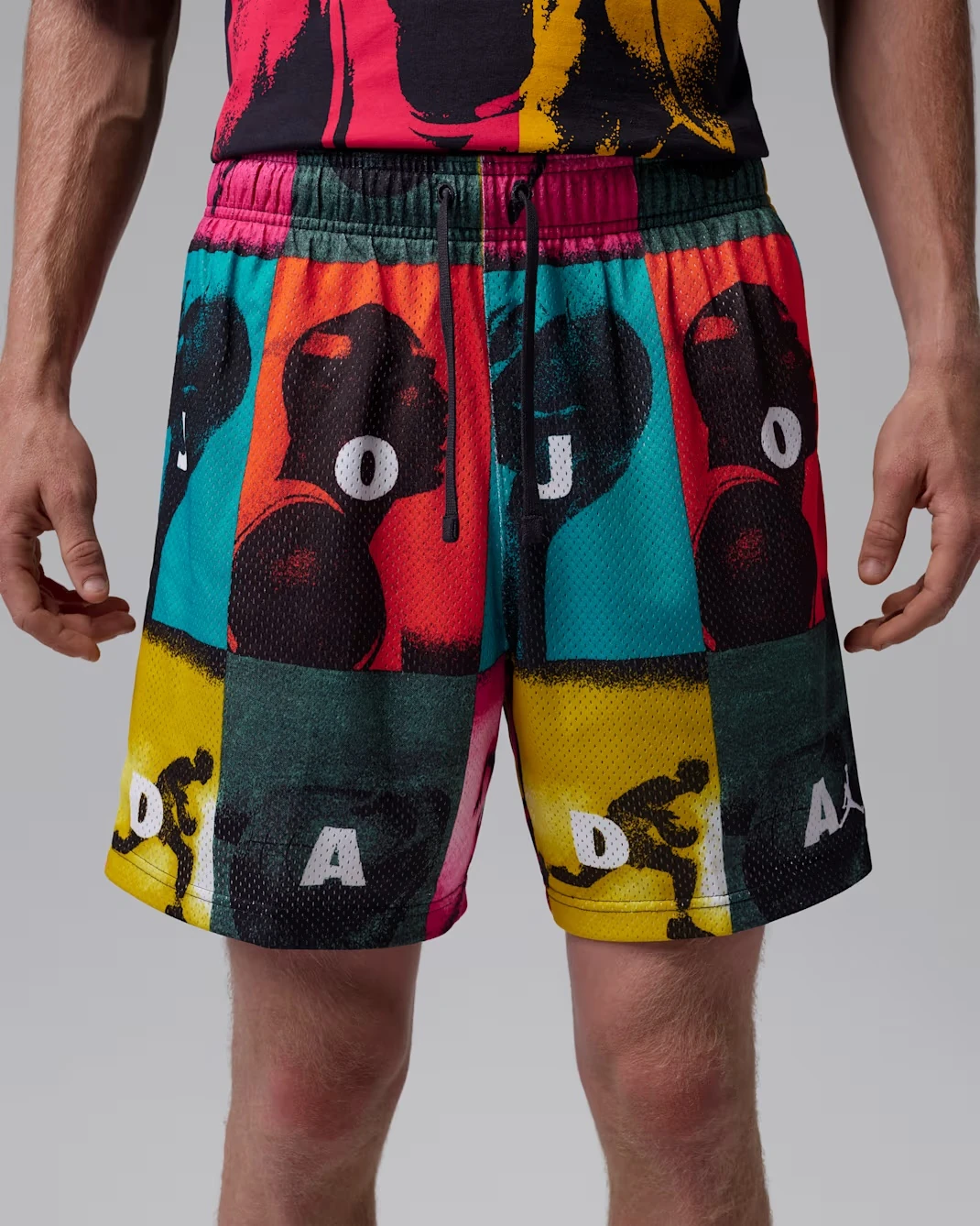 Front view of Jordan Brooklyn mesh shorts in White with multicolor comic-inspired graphics.