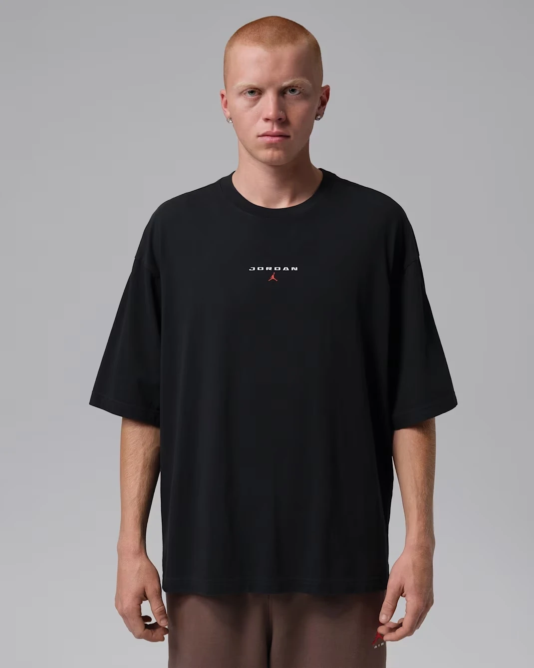 Black Jordan Flight Essentials oversized patch T-shirt paired with the Air Jordan 1 Mid Black/Palomino.