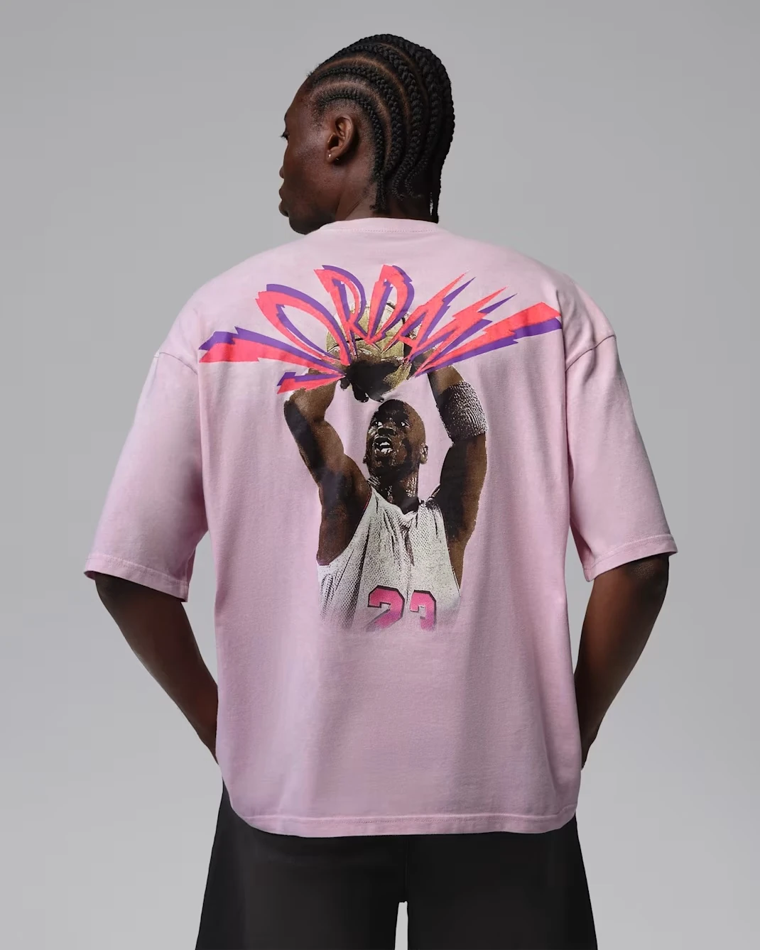 Back view of the Jordan Flight T-Shirt in Iced Carmine featuring oversized Michael Jordan artwork.