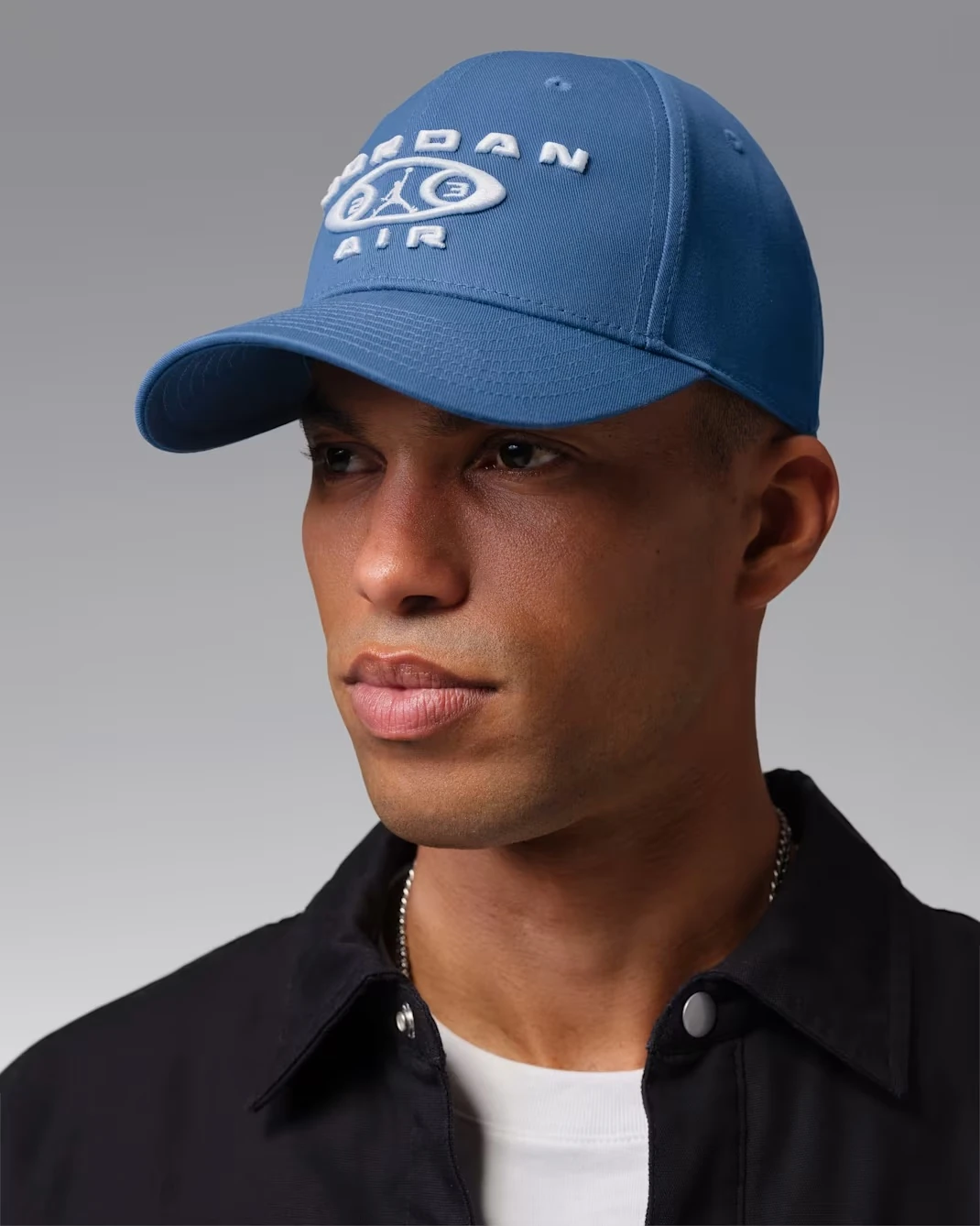 Angled front view of the Jordan Rise Structured Snapback Cap in True Blue and White worn by a model.