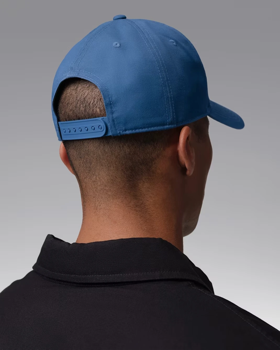 Rear view of the Jordan Rise Structured Snapback Cap in True Blue and White with the adjustable snapback closure.
