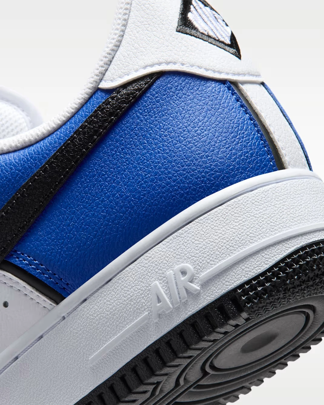 Close-up of the heel and midsole on the Nike Air Force 1 '07 LV8 in Old Royal, White, Metallic Silver and Black.