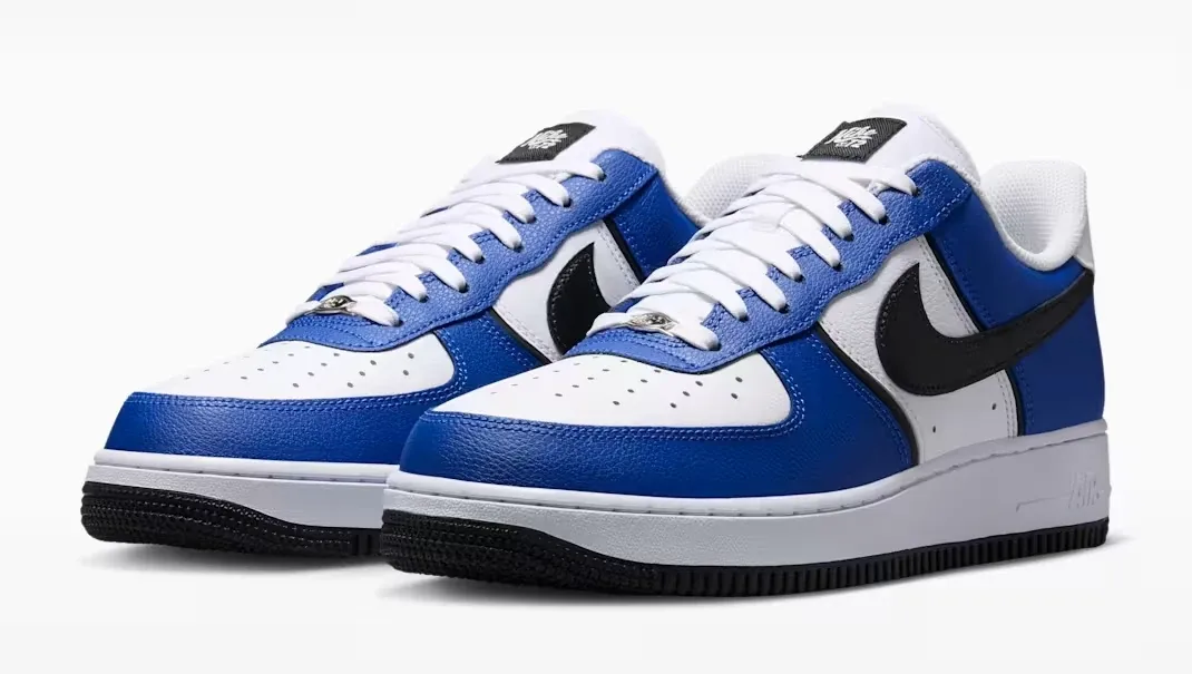 Angled pair of Nike Air Force 1 '07 LV8 sneakers in Old Royal, White, Metallic Silver and Black.