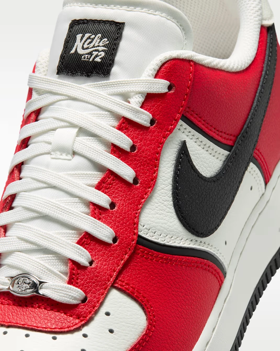 Close-up of the Black Nike Swoosh on the Air Force 1 '07 LV8 University Red Sail Black.