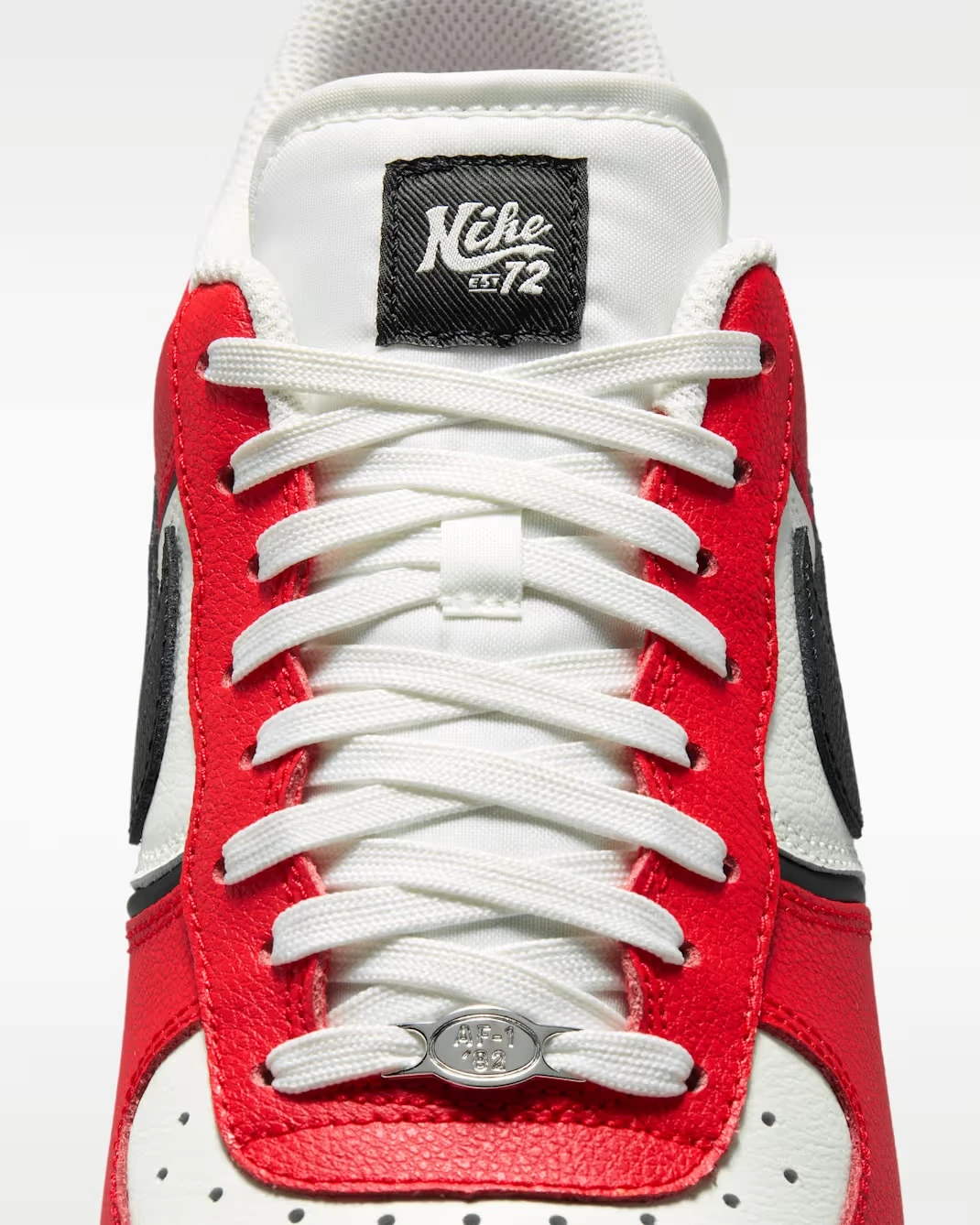 Close-up of the tongue and laces on the Nike Air Force 1 '07 LV8 University Red Sail Black.