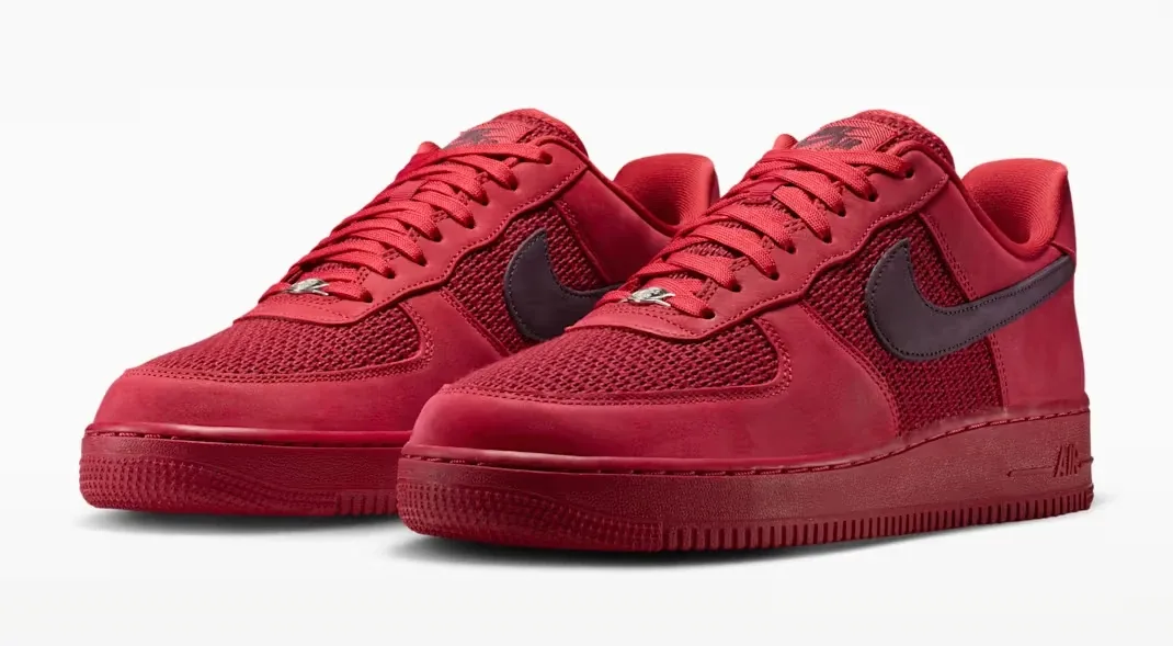 Angled view of the Nike Air Force 1 Low "Tough Red" sneakers in Tough Red, Team Red and Metallic Silver.