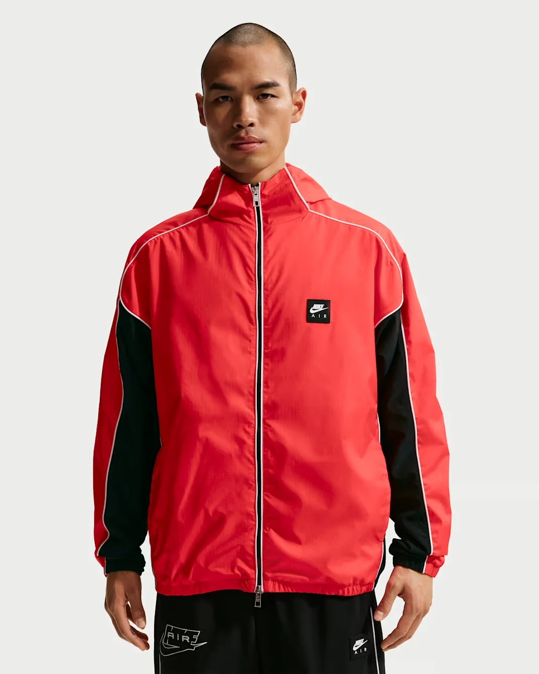 Front view of the Nike Air Hybrid Utility Jacket in Solar Red with Black sleeves