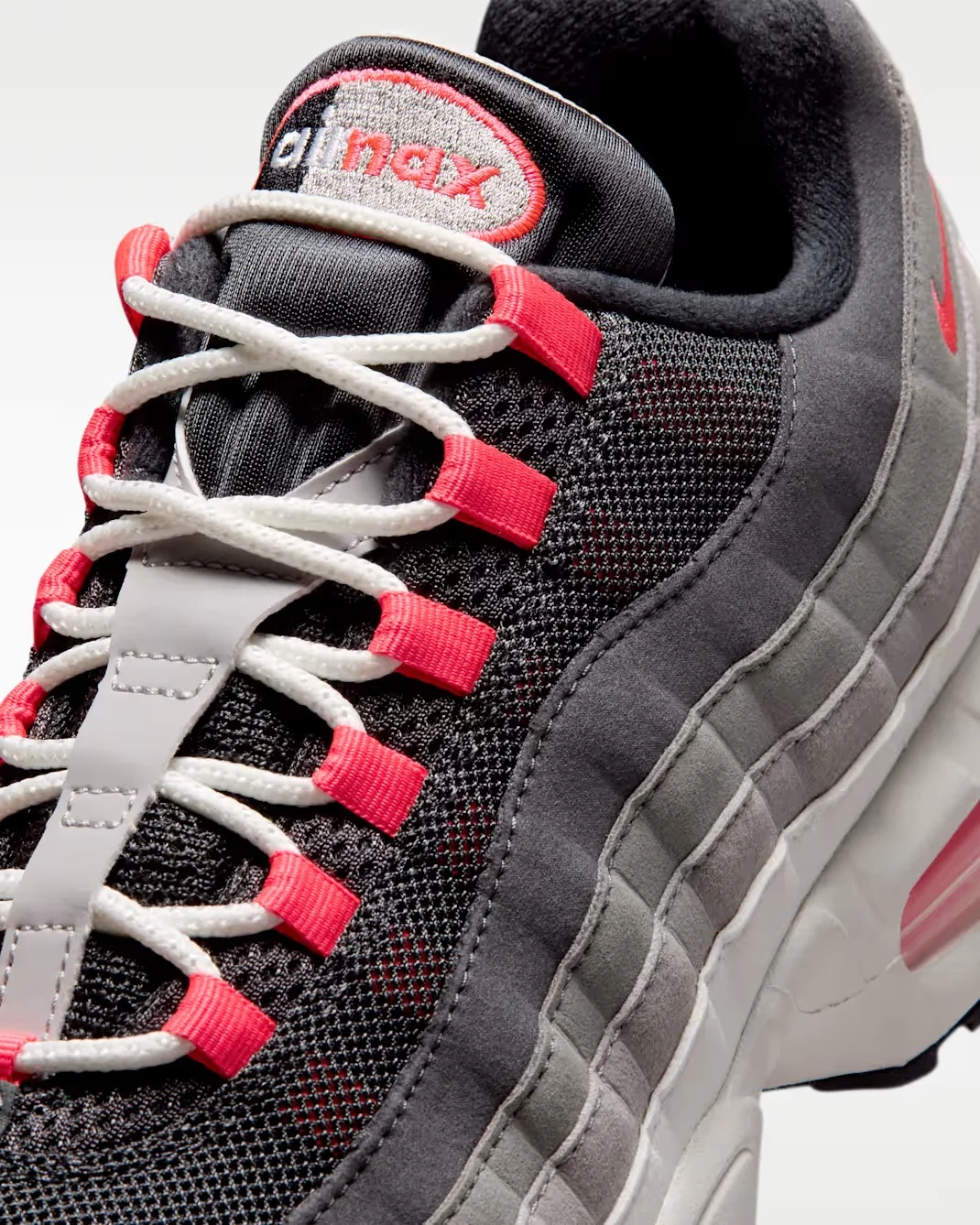Close-up of the Nike Air Max 95 Big Bubble rope laces and Solar Red lace loops