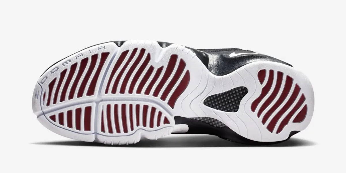 Outsole view of the Nike Air Zoom Flight "The Glove" in Black, White and University Red.
