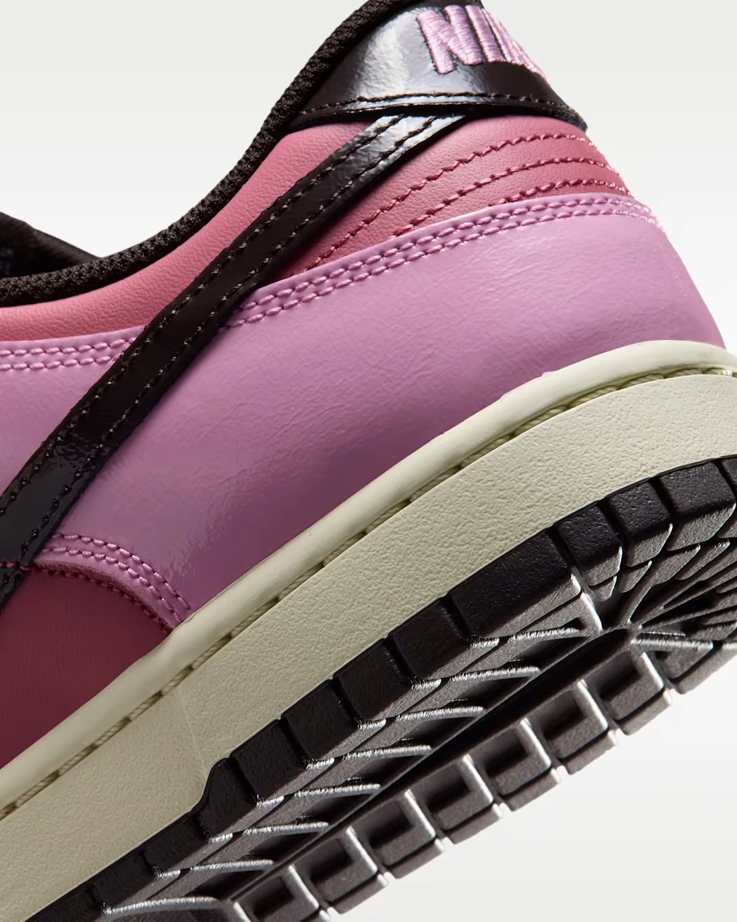 Close-up of the Nike Dunk Low "Pink Donut" heel, Beach midsole and Velvet Brown rubber outsole.