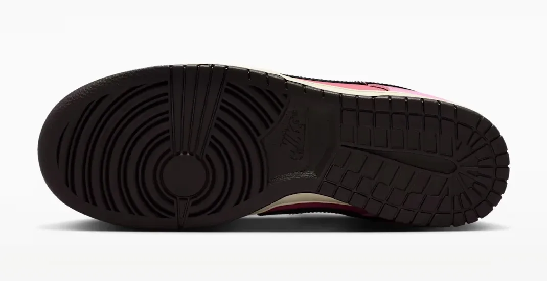 Outsole view of the Nike Dunk Low "Pink Donut" in Pink Rise, Elemental Pink, Beach and Velvet Brown.