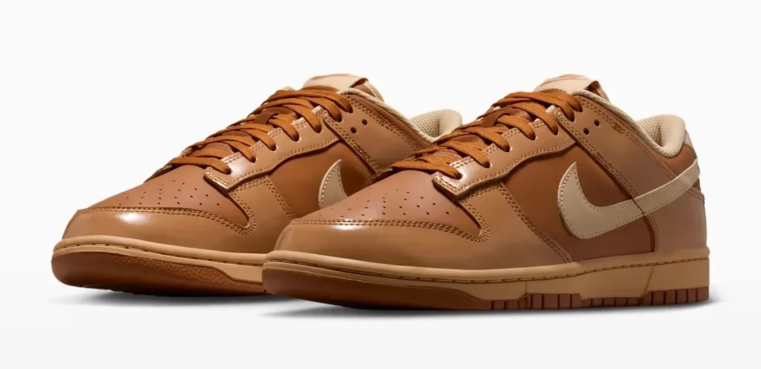 Three-quarter front view of the Nike Dunk Low "Wheat Donut" pair in Tawny, Flax, Twine and Sesame.