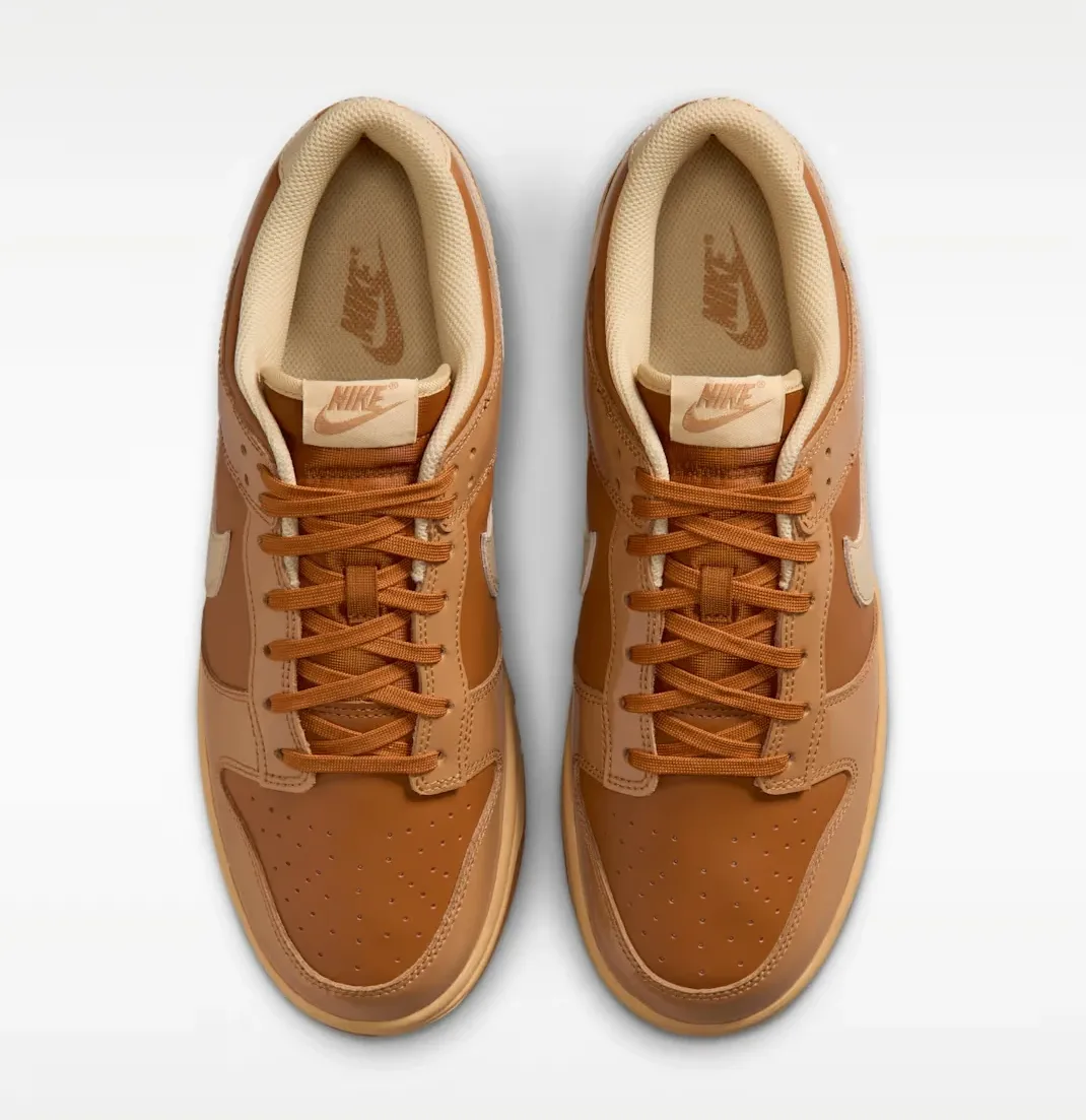Top-down view of the Nike Dunk Low "Wheat Donut" pair featuring Tawny, Flax, Twine and Sesame colors.
