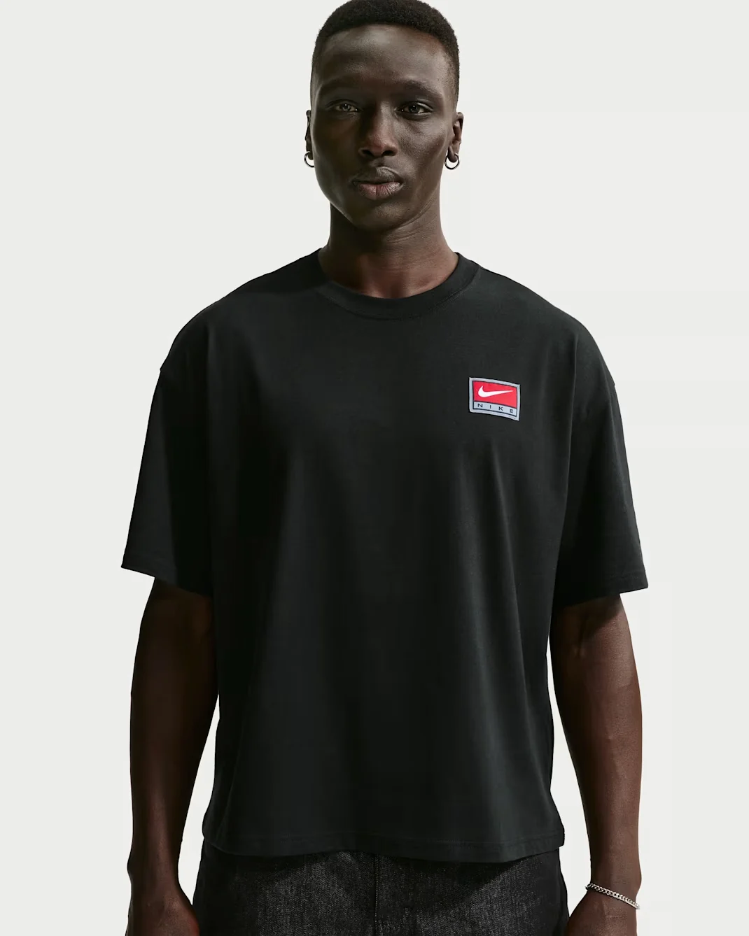 Black Nike Life boxy knit T-shirt with red Nike patch logo