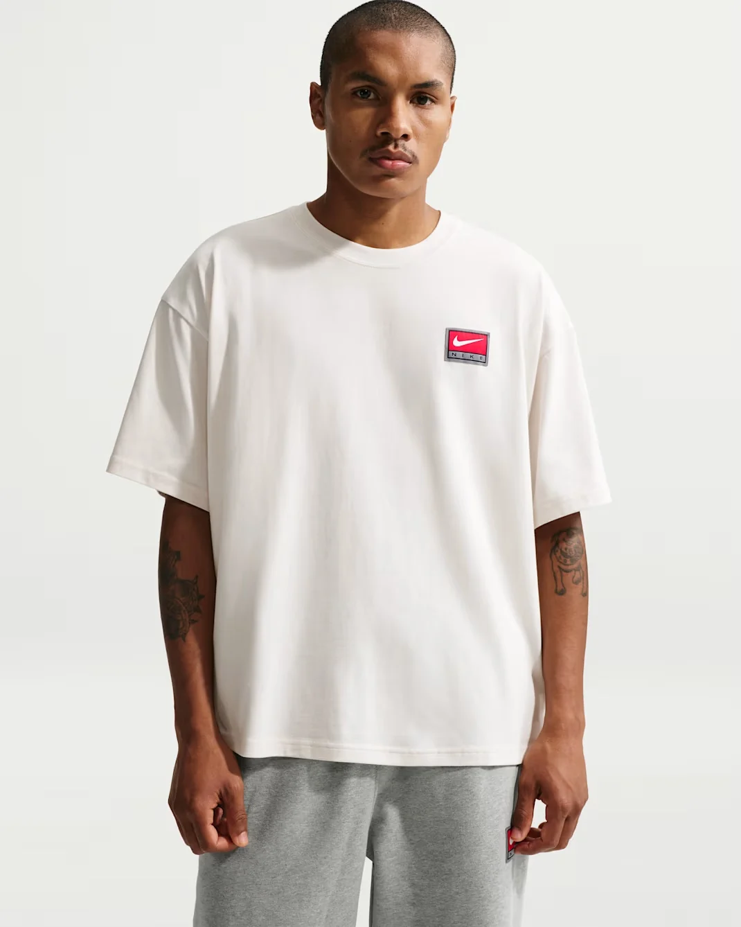 White Nike Life boxy knit T-shirt with red Nike patch logo