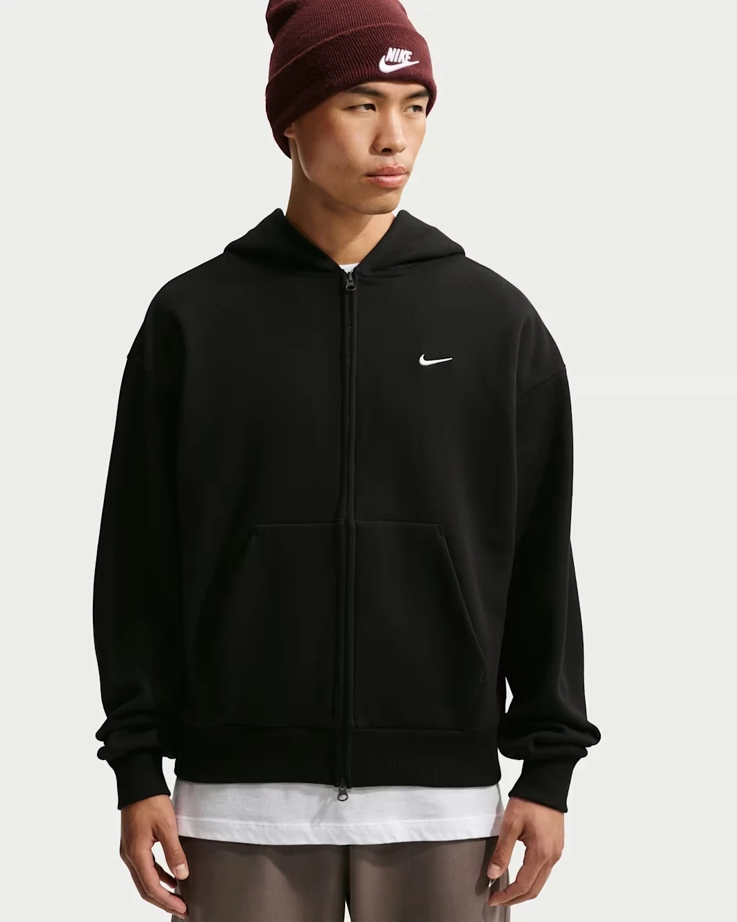 Nike Solo Fleece Men's Full-Zip Hoodie in black with a white Swoosh logo.