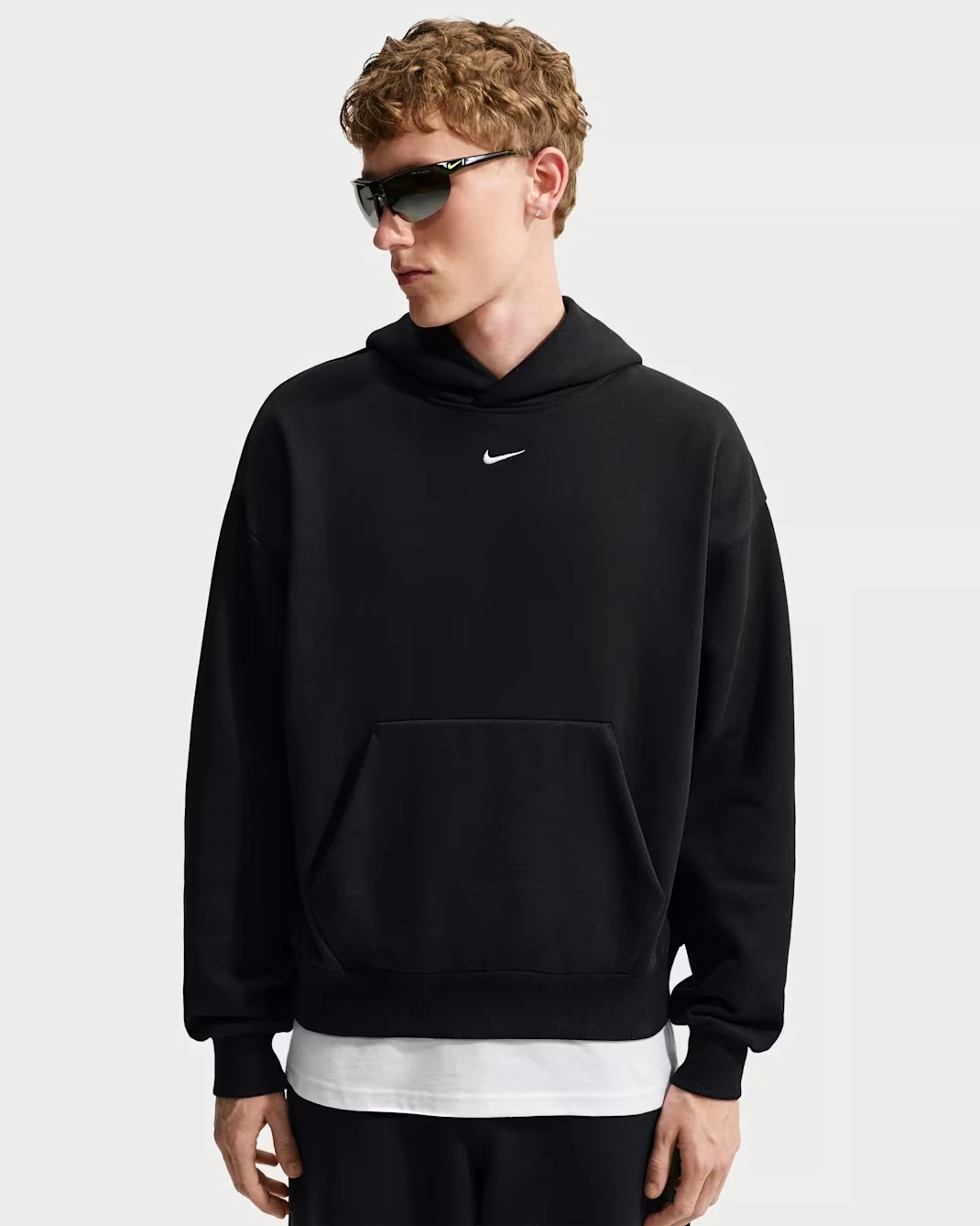 Nike Solo Fleece Men's Pullover Hoodie in black with a white Swoosh logo.
