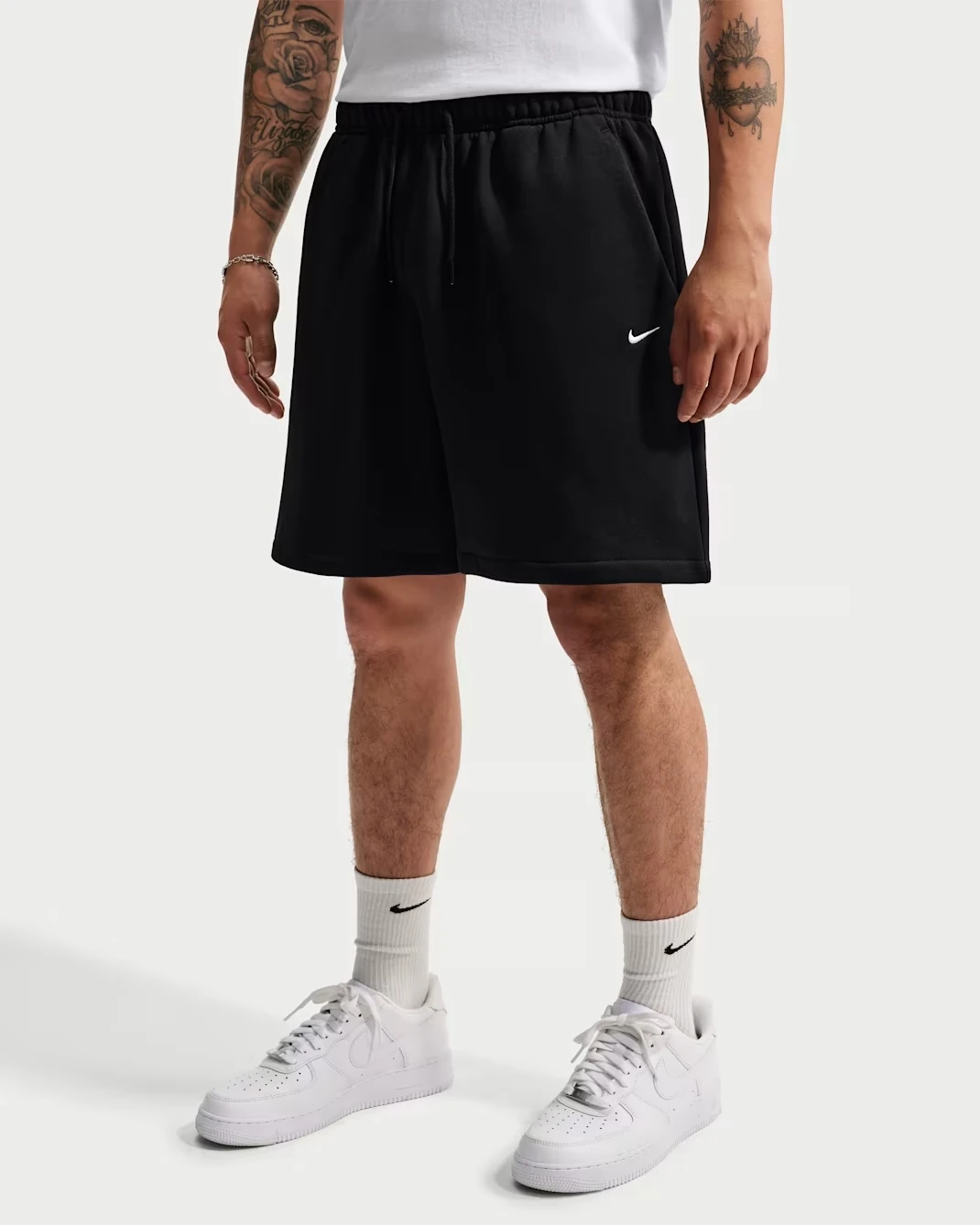 Nike Solo Fleece Men's Shorts in black featuring a white Swoosh logo.